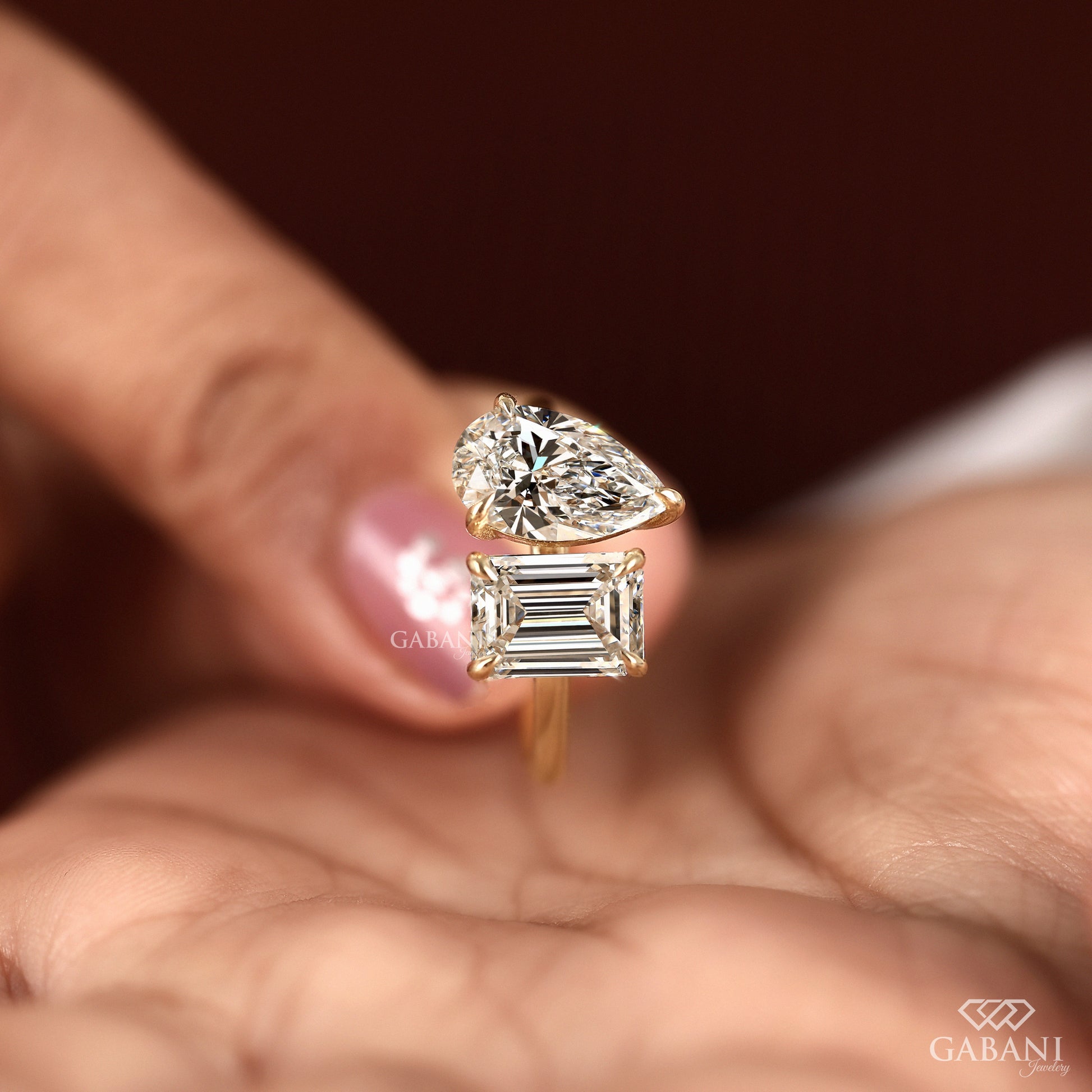 Emerald cut and pear cut lab created diamond ring in 14K yellow gold with classic Toi et Moi styling