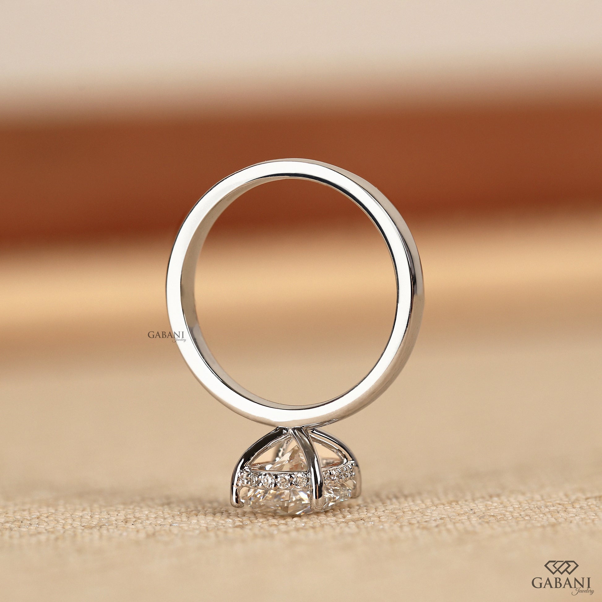 oval lab grown diamond engagement ring with hidden halo basket setting
