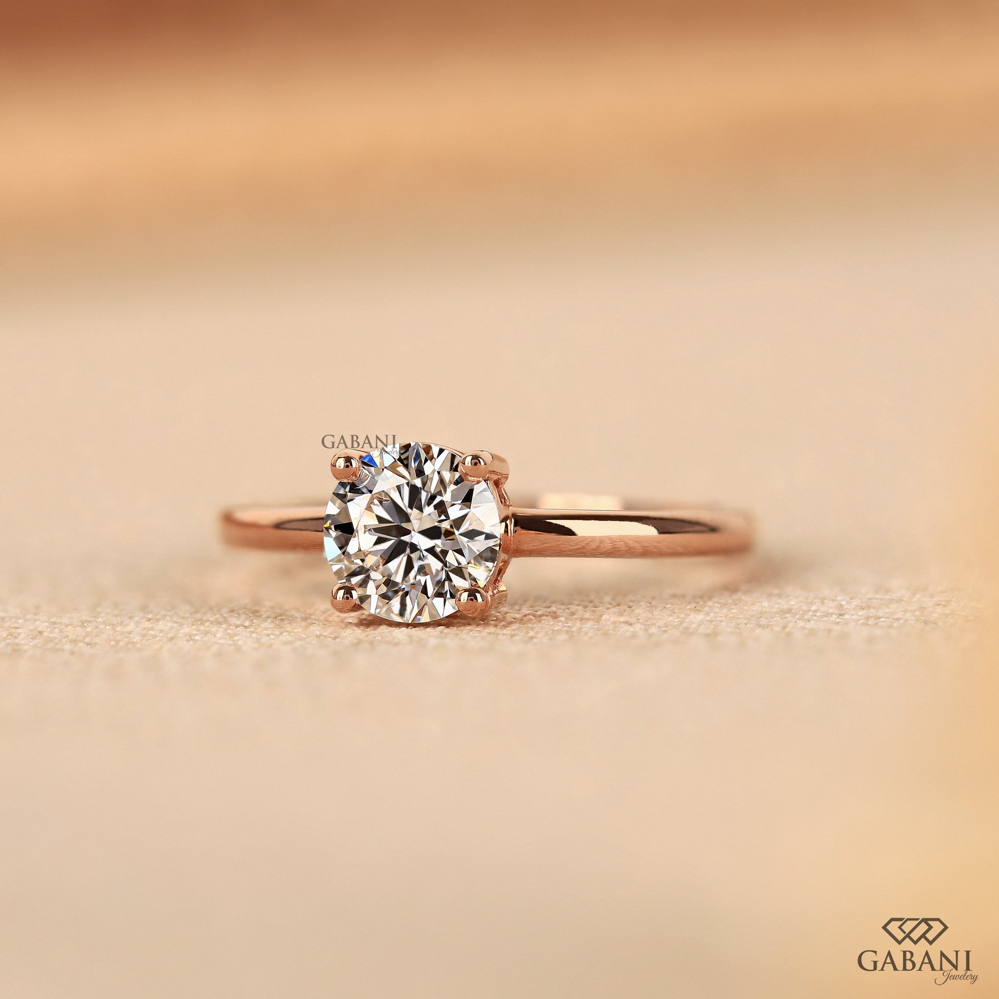 round cut lab created diamond ring with clean solitaire design in rose gold