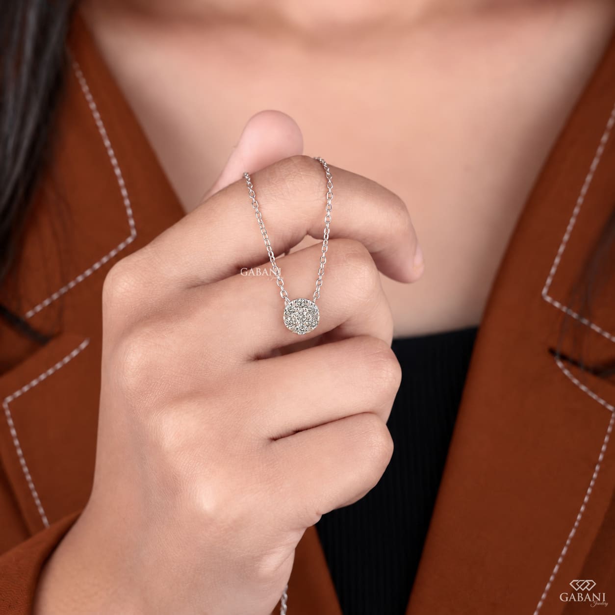 Seven stone round cut lab grown diamond floral cluster necklace in 18K white gold with a delicate cable chain and prong setting.