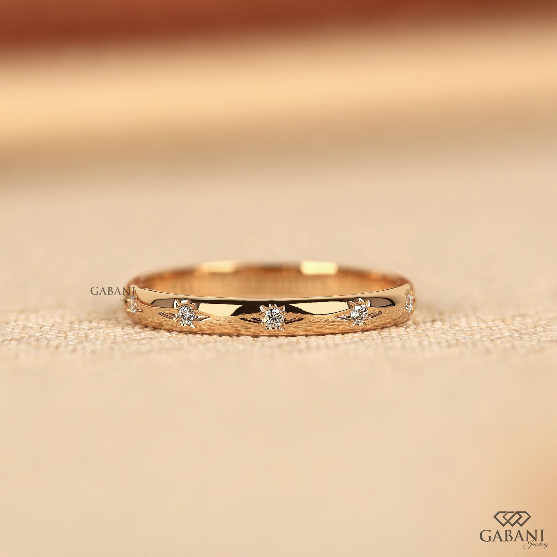 celestial star wedding band with flush set lab grown diamonds in slim yellow gold
