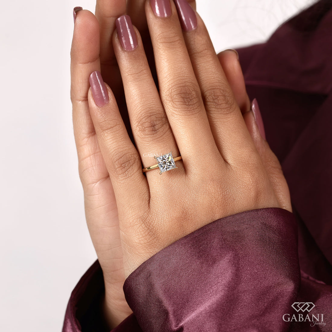 princess cut lab grown diamond solitaire engagement ring in 18K yellow gold with a classic four prong setting and polished band.