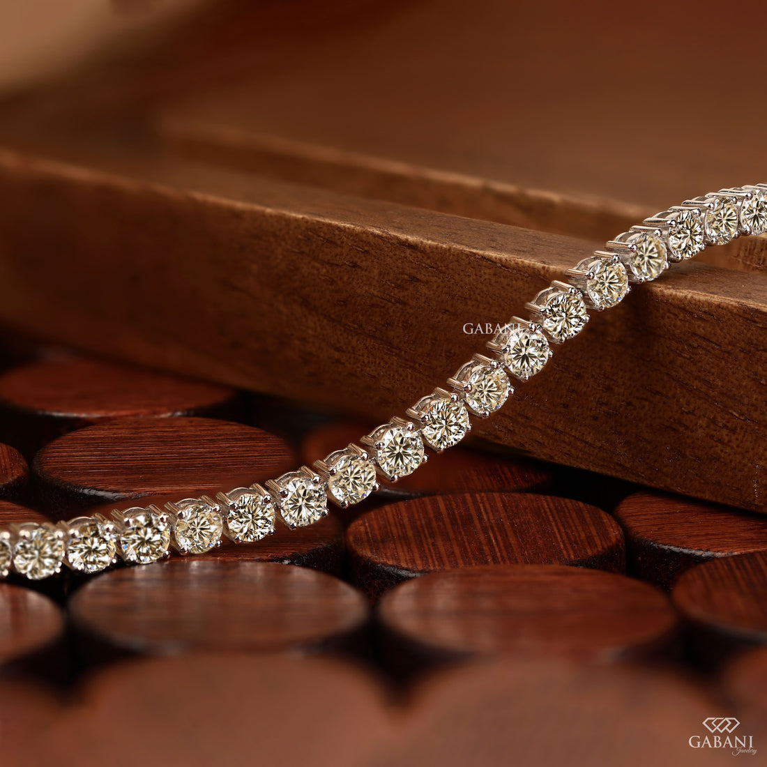 Round cut lab grown diamond tennis bracelet with EF color VS1 clarity diamonds in classic four prong settings and secure clasp.