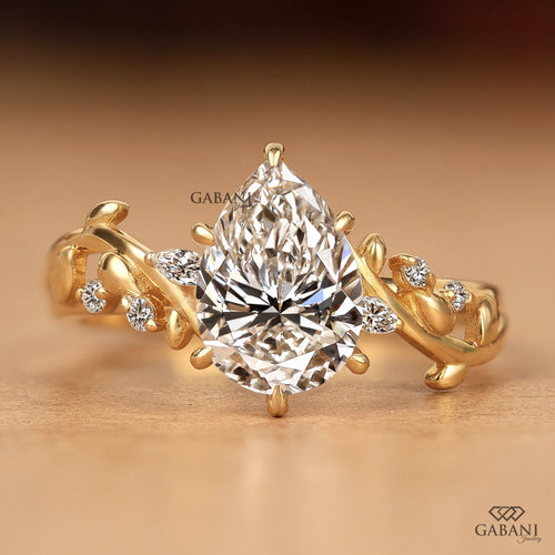 Front view of Gabani Jewelry nature inspired pear cut lab grown diamond engagement ring in solid gold