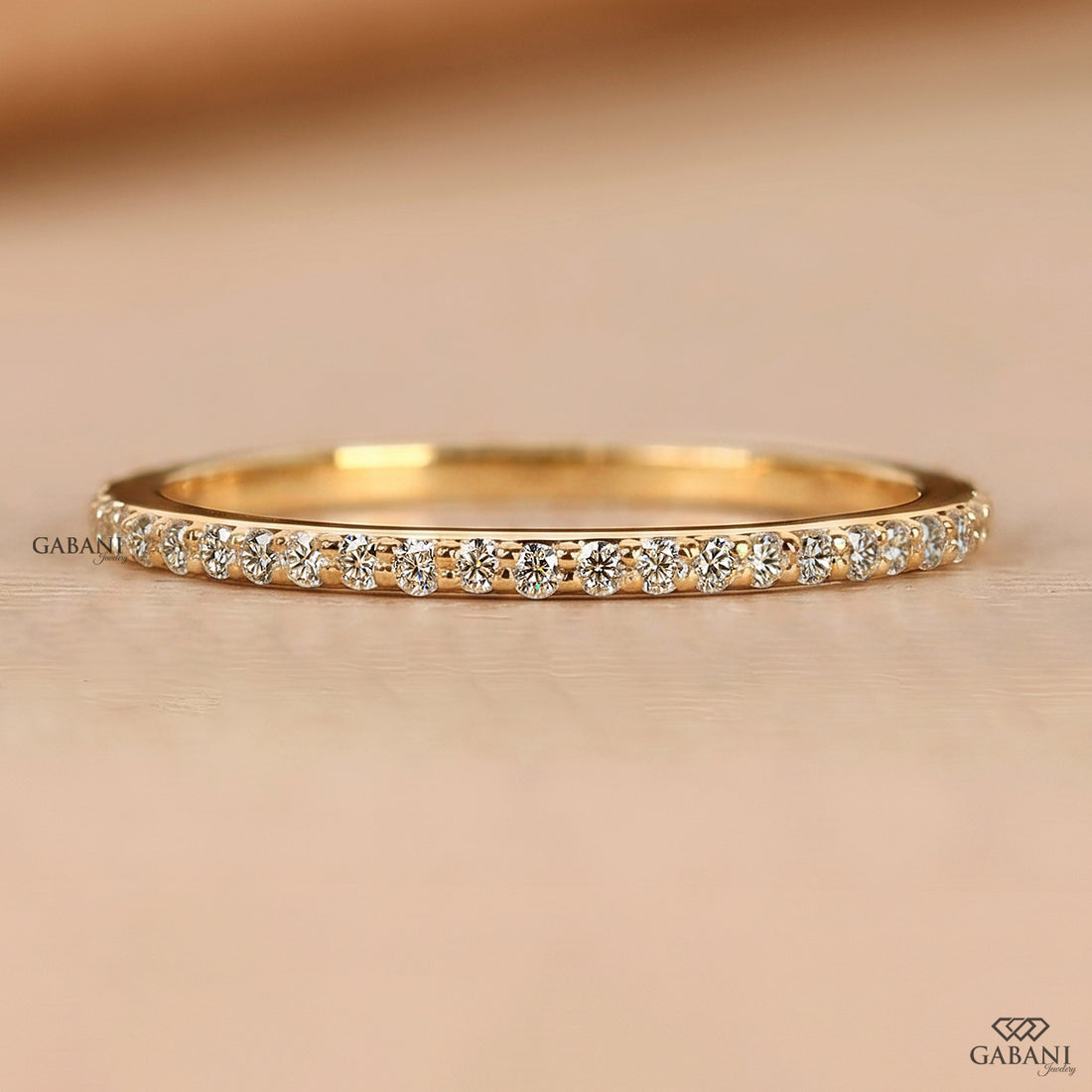 Natural diamond half eternity wedding band with a minimal pave set design