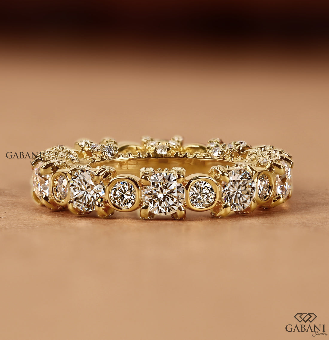 Round cut lab grown diamond wedding band with bezel and prong set stones
