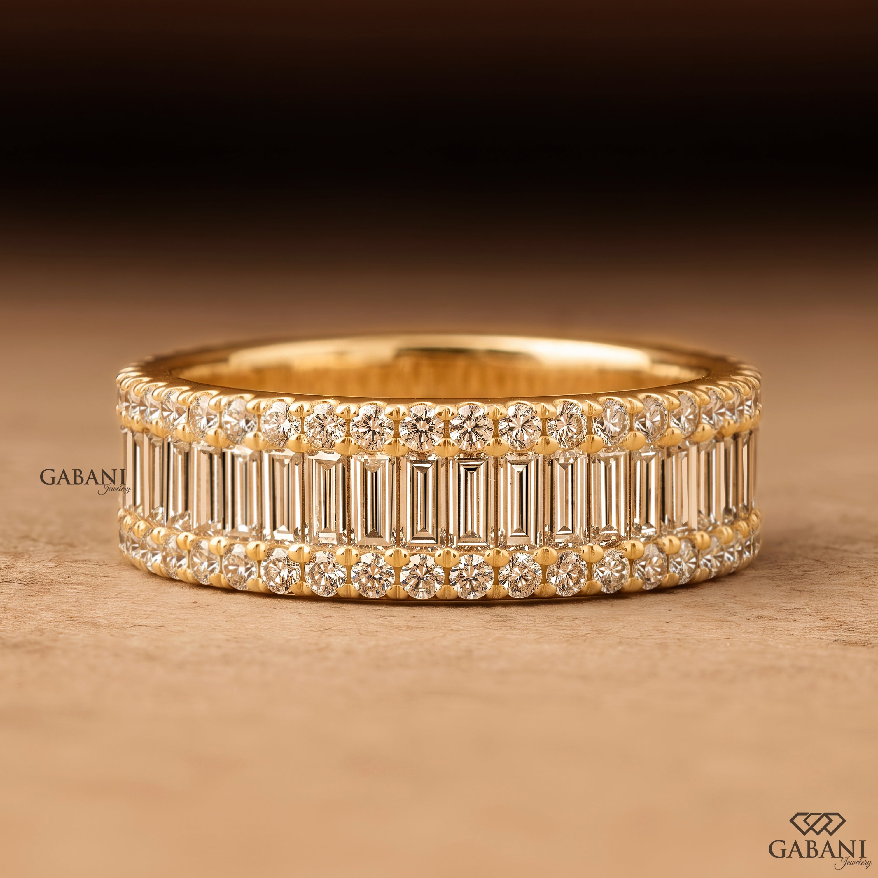 Front view of Gabani Jewelry wide yellow gold wedding band with baguette and round lab grown diamonds