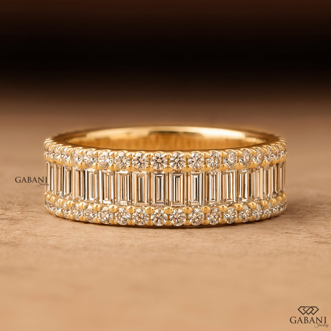 Front view of Gabani Jewelry wide yellow gold wedding band with baguette and round lab grown diamonds