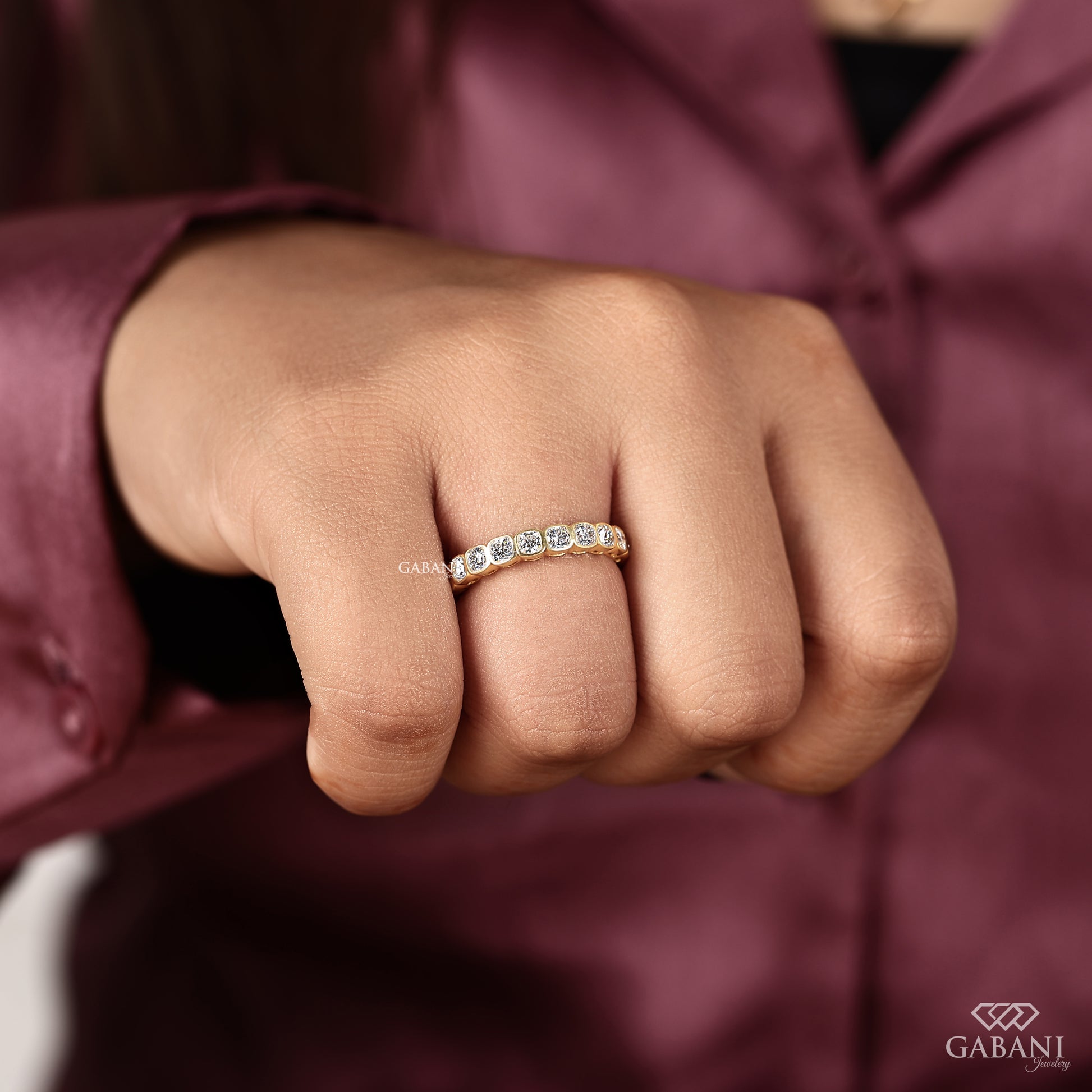 Bezel set cushion cut diamond eternity band crafted with certified lab grown diamonds