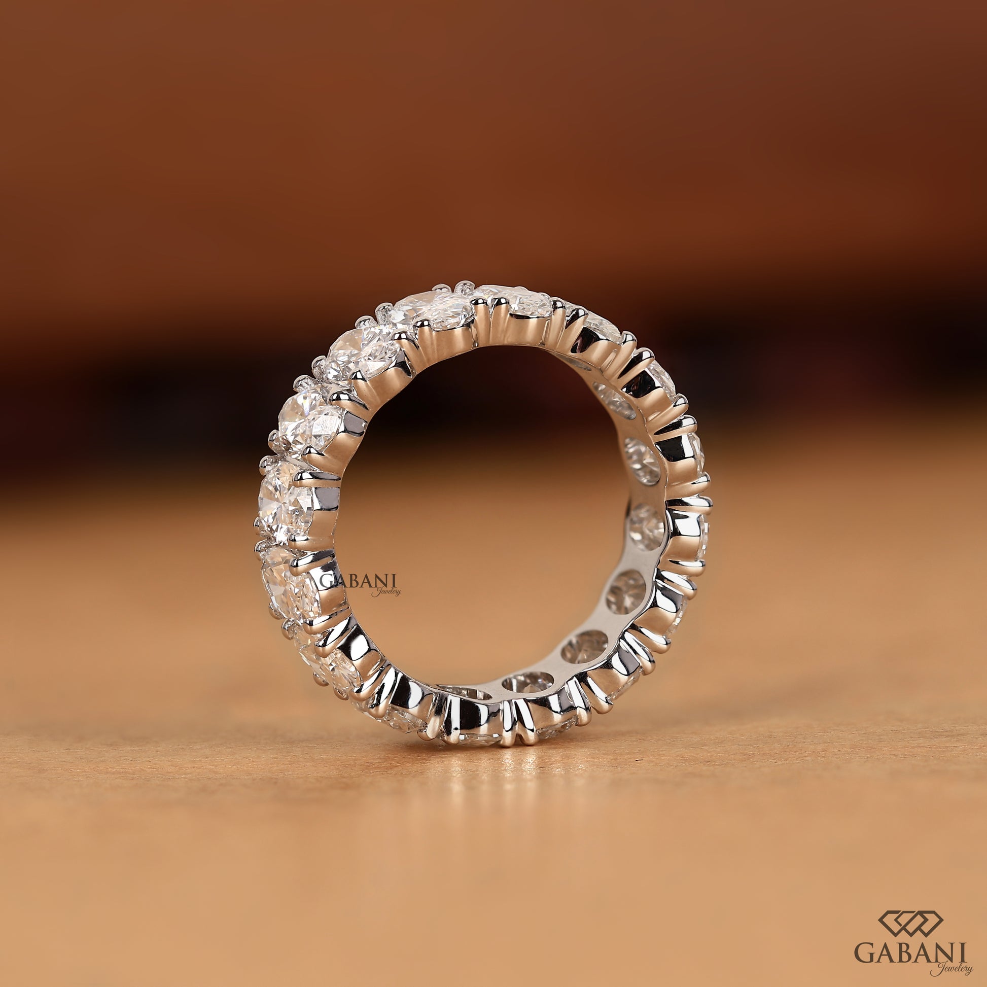 white gold oval cut lab grown diamond wide eternity wedding band