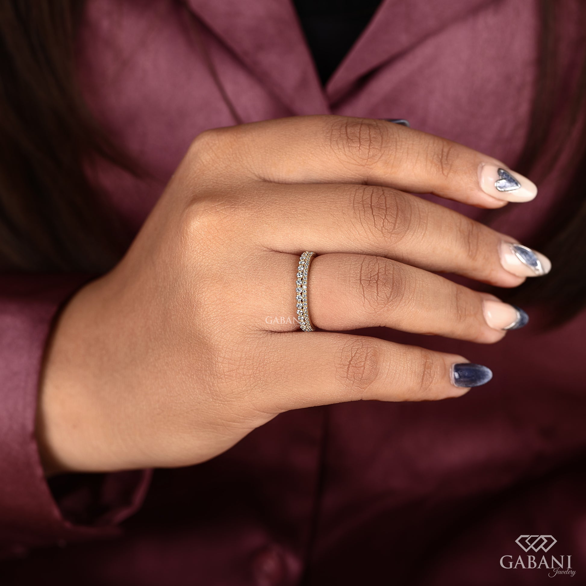 yellow gold lab grown diamond band featuring a double row design with pave and prong set stones