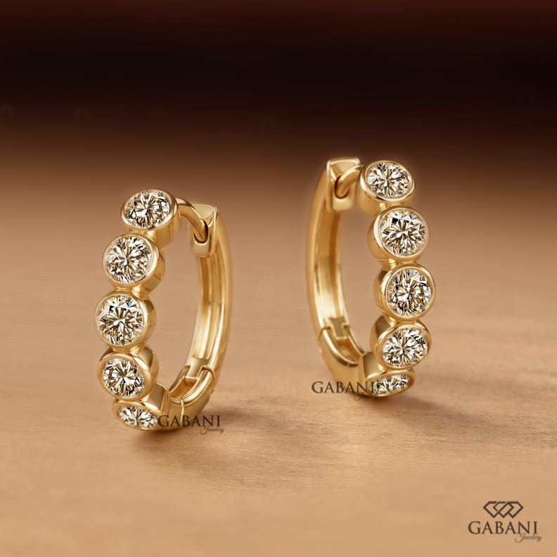 Graduated Round Diamond Bezel Huggie Hoop Earrings in Yellow Gold
