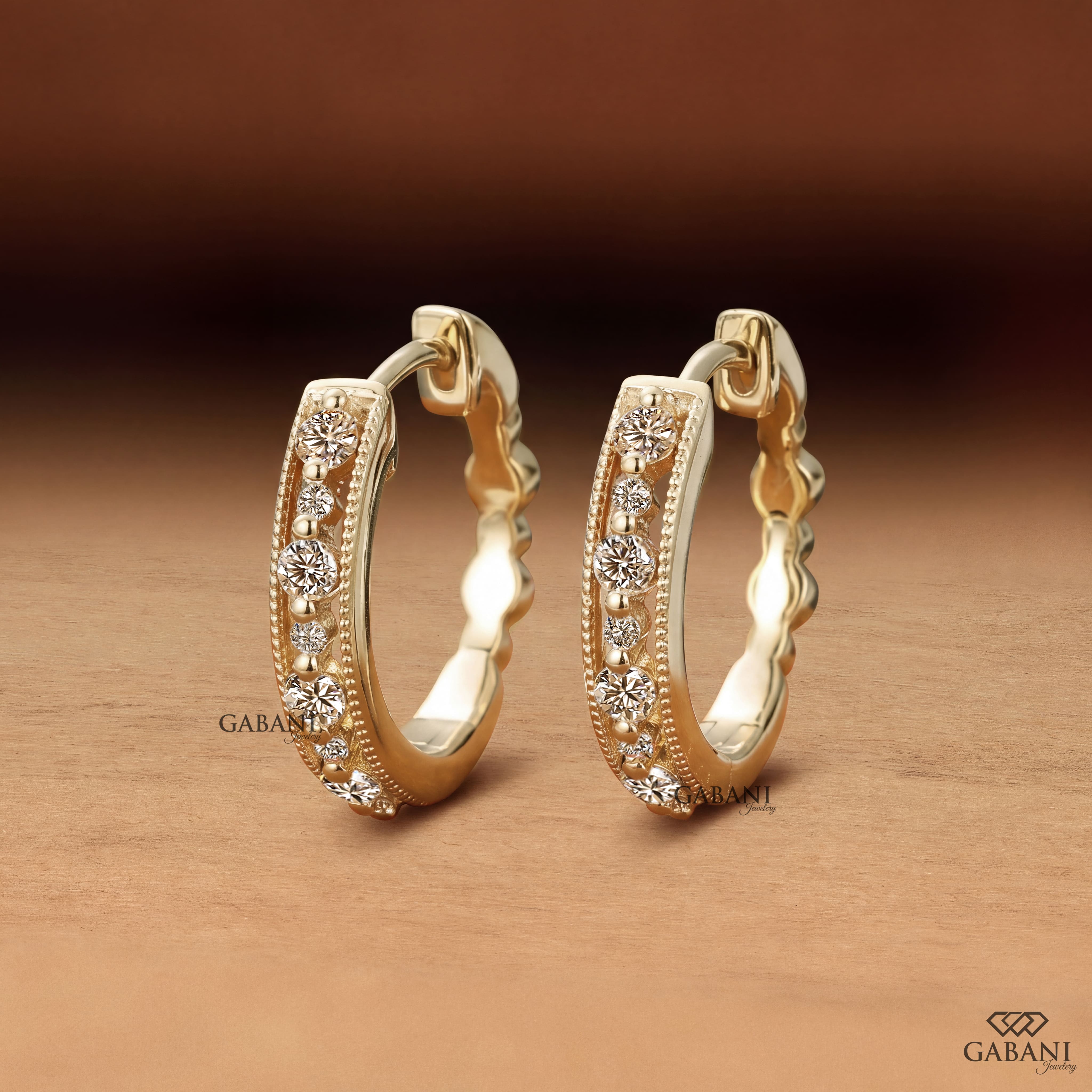 Round cut diamond milgrain hoop earrings in yellow gold with graduated diamonds