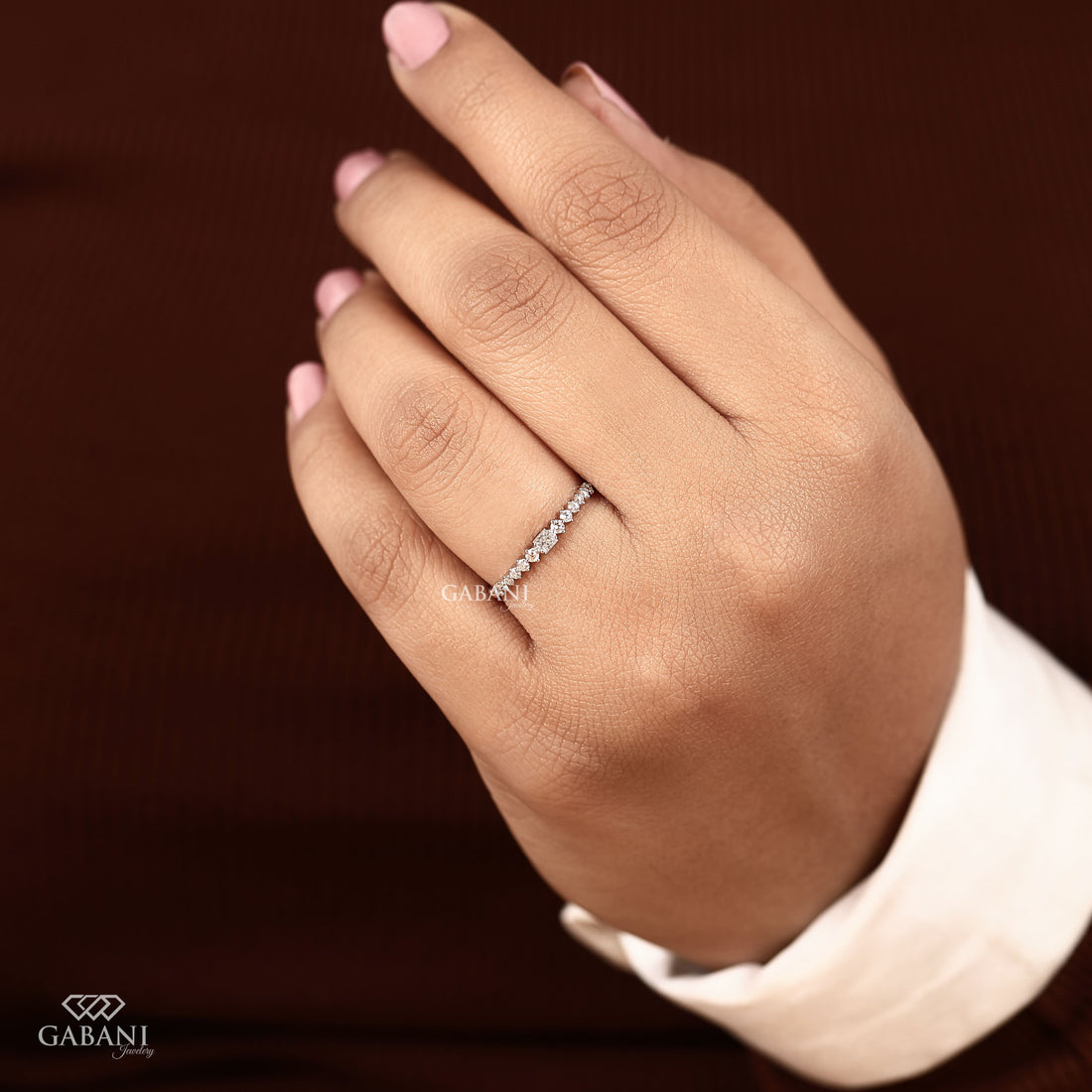 Princess cut and round lab grown diamond wedding band in white gold with graduated prong set diamond design.