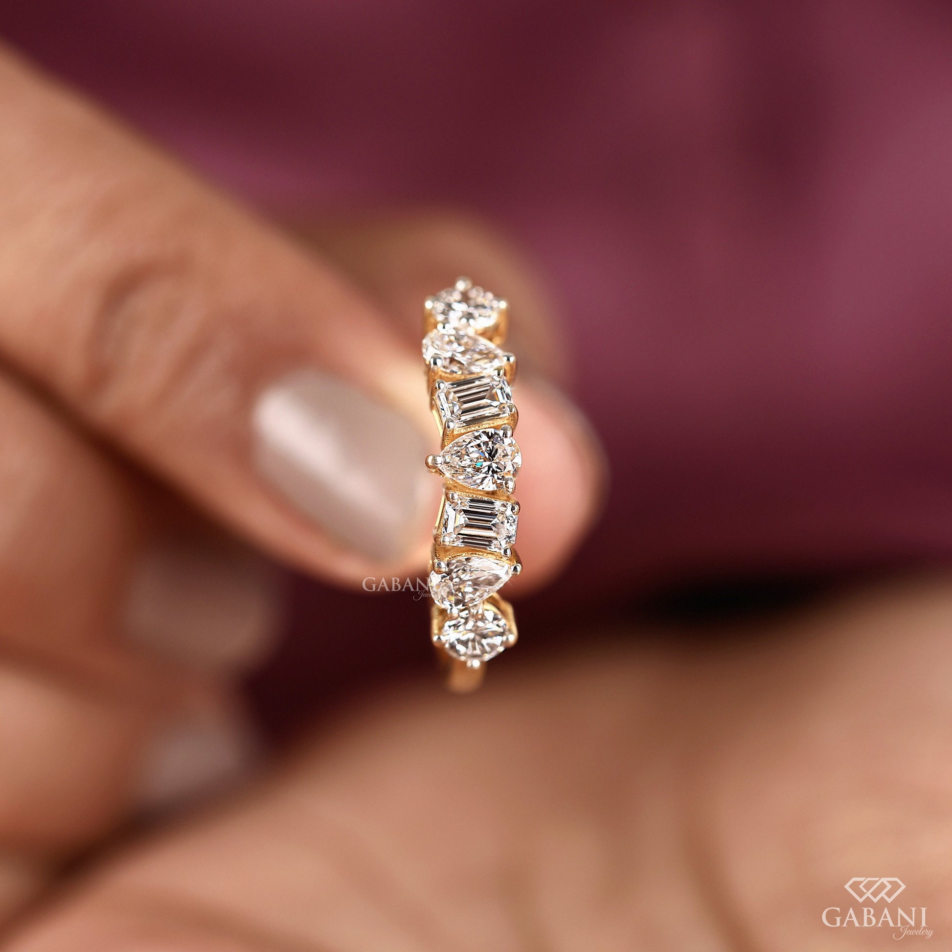 Lab grown diamond band for women with emerald pear and round cut stones