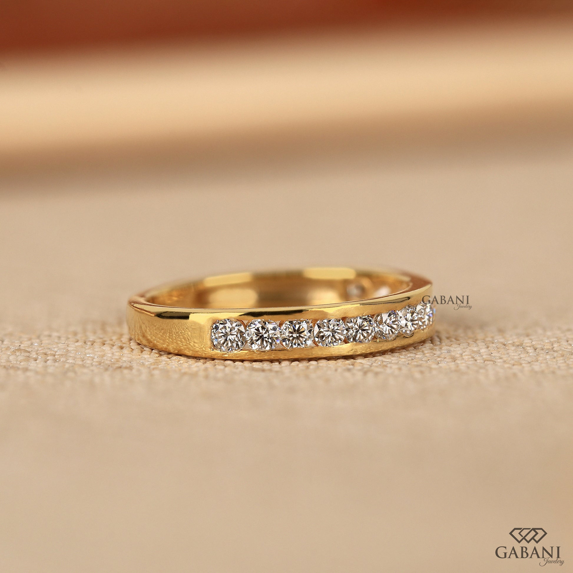 half eternity lab grown diamond band with round stones in yellow gold