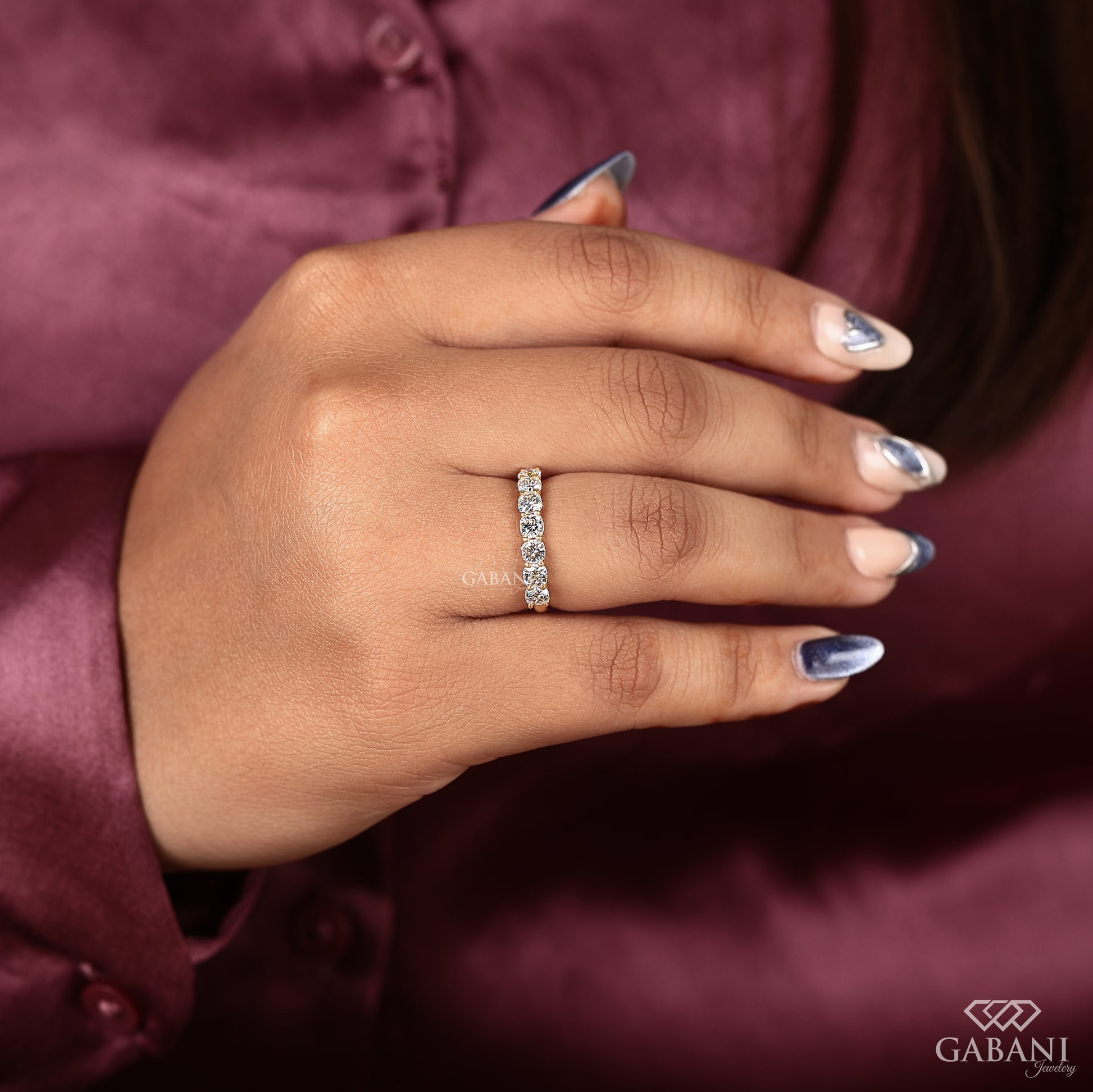 yellow gold wedding band featuring seven cushion cut lab created diamonds