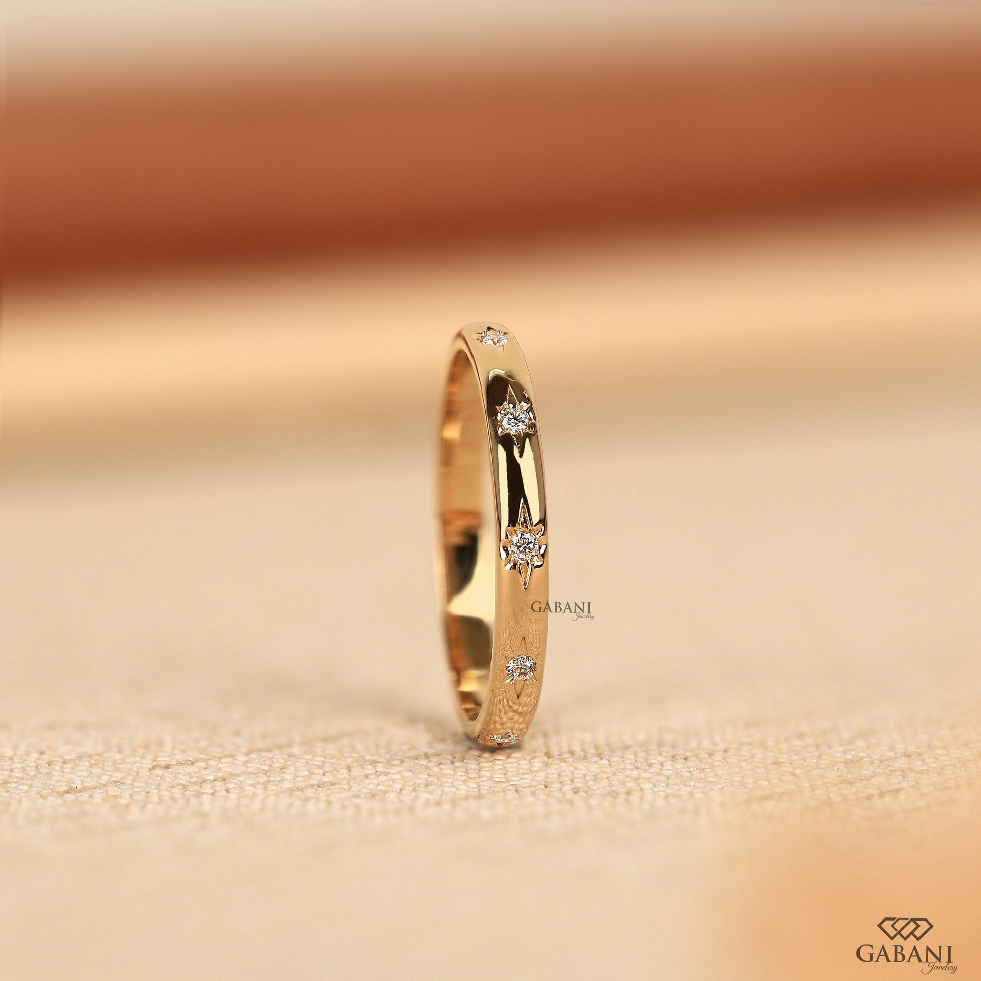 smooth yellow gold band with certified lab grown flush set diamonds
