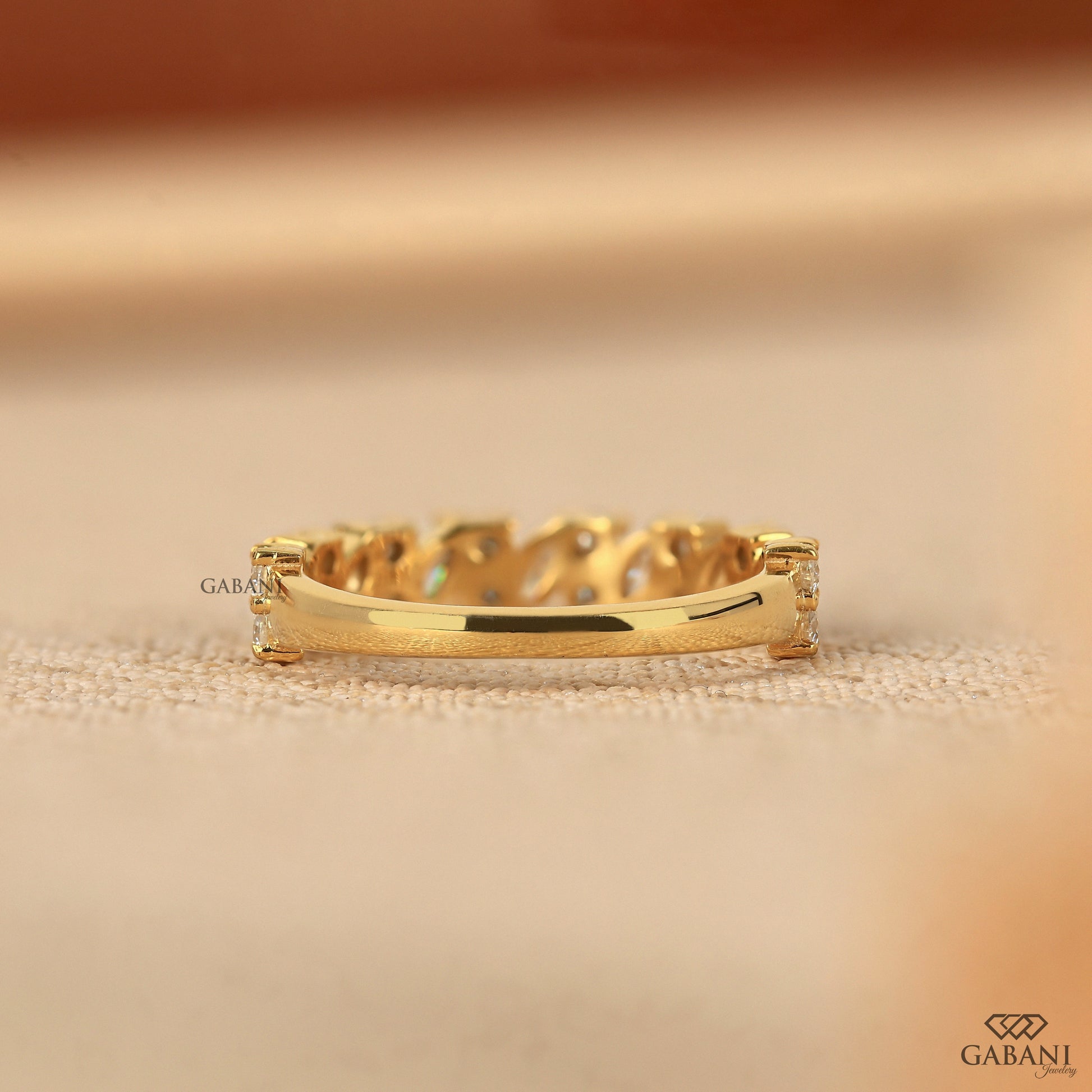 lab grown diamond band with marquise and round stones designed as a sleek half eternity ring