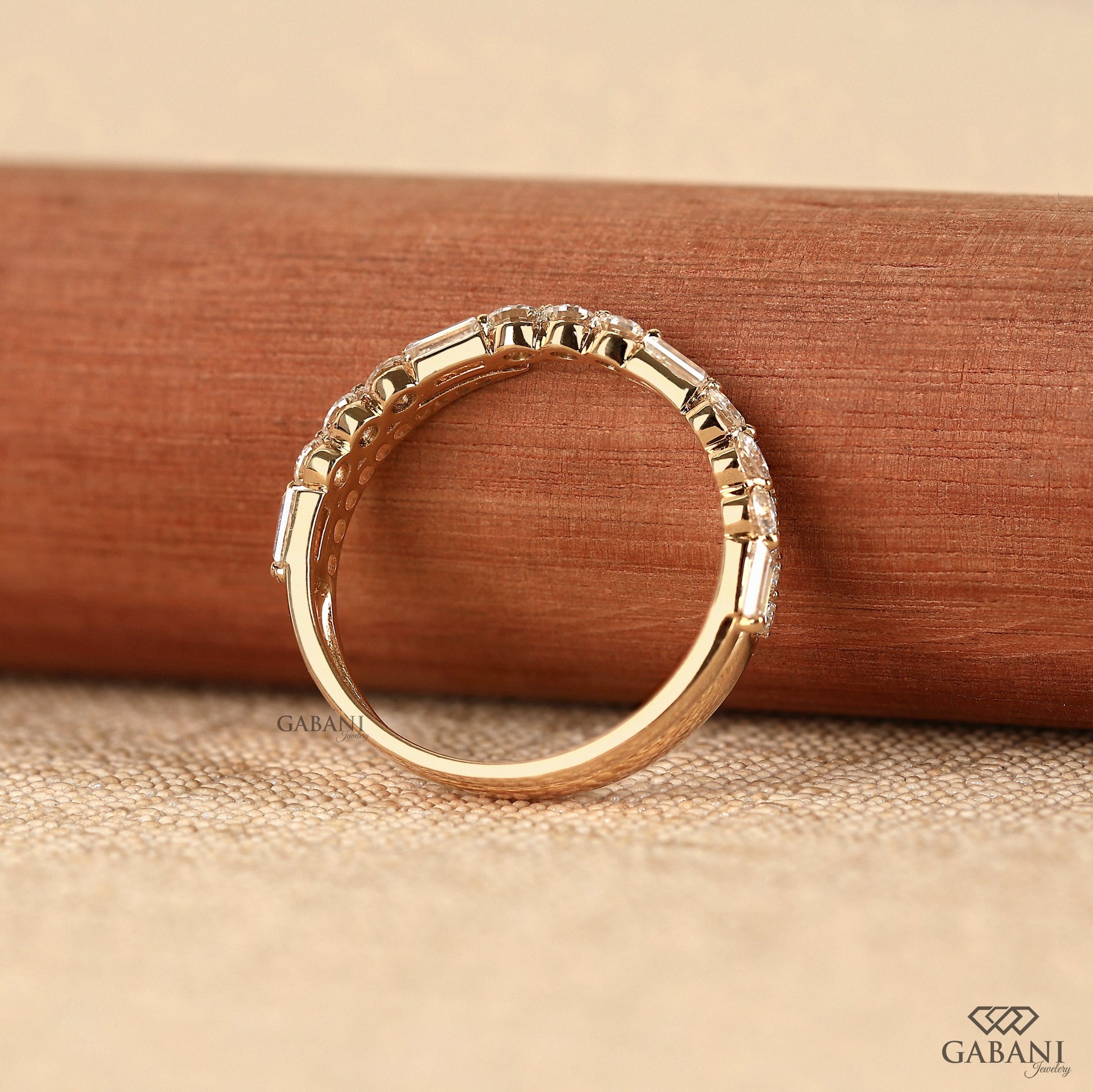 lab grown diamond wedding band with baguette and round cut stone layout