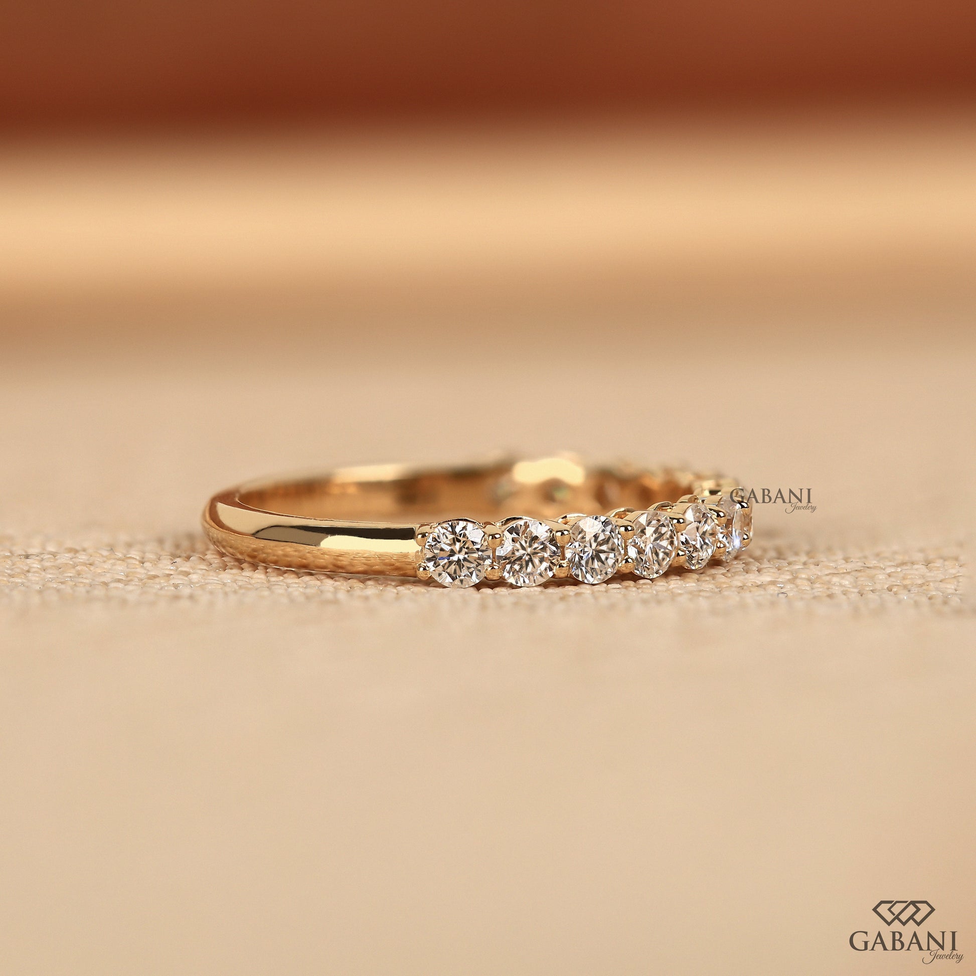 Certified lab grown round diamond wedding band in yellow gold prong setting