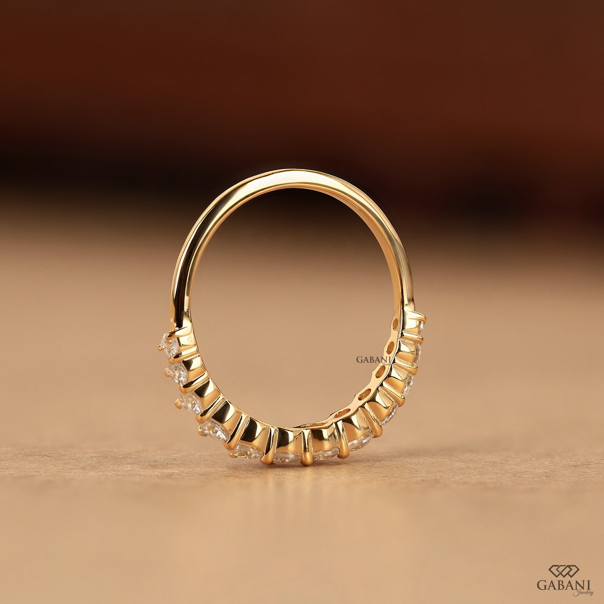 stackable lab diamond band with round stones in thin yellow gold setting