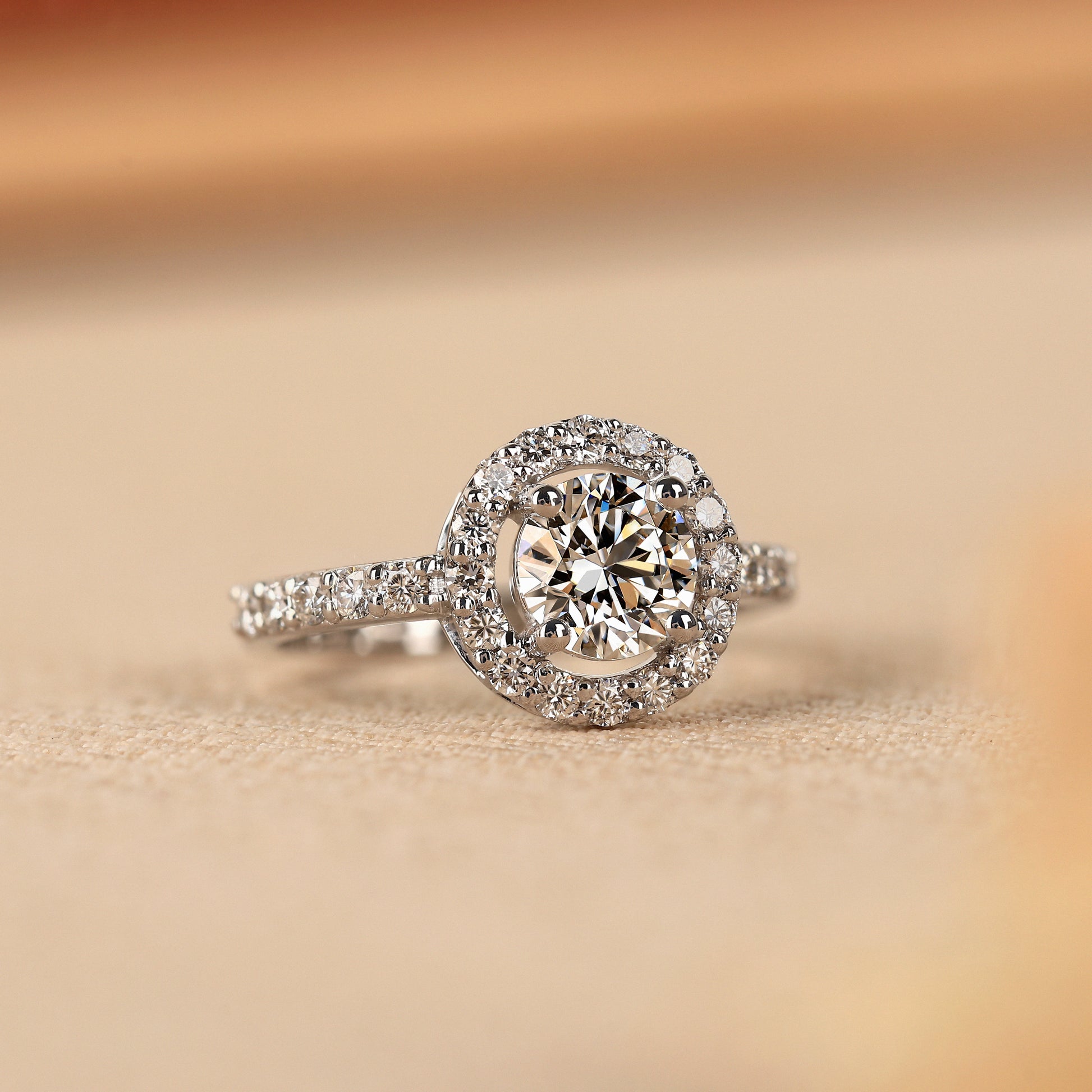 lab created round diamond halo ring with prong and pavé setting