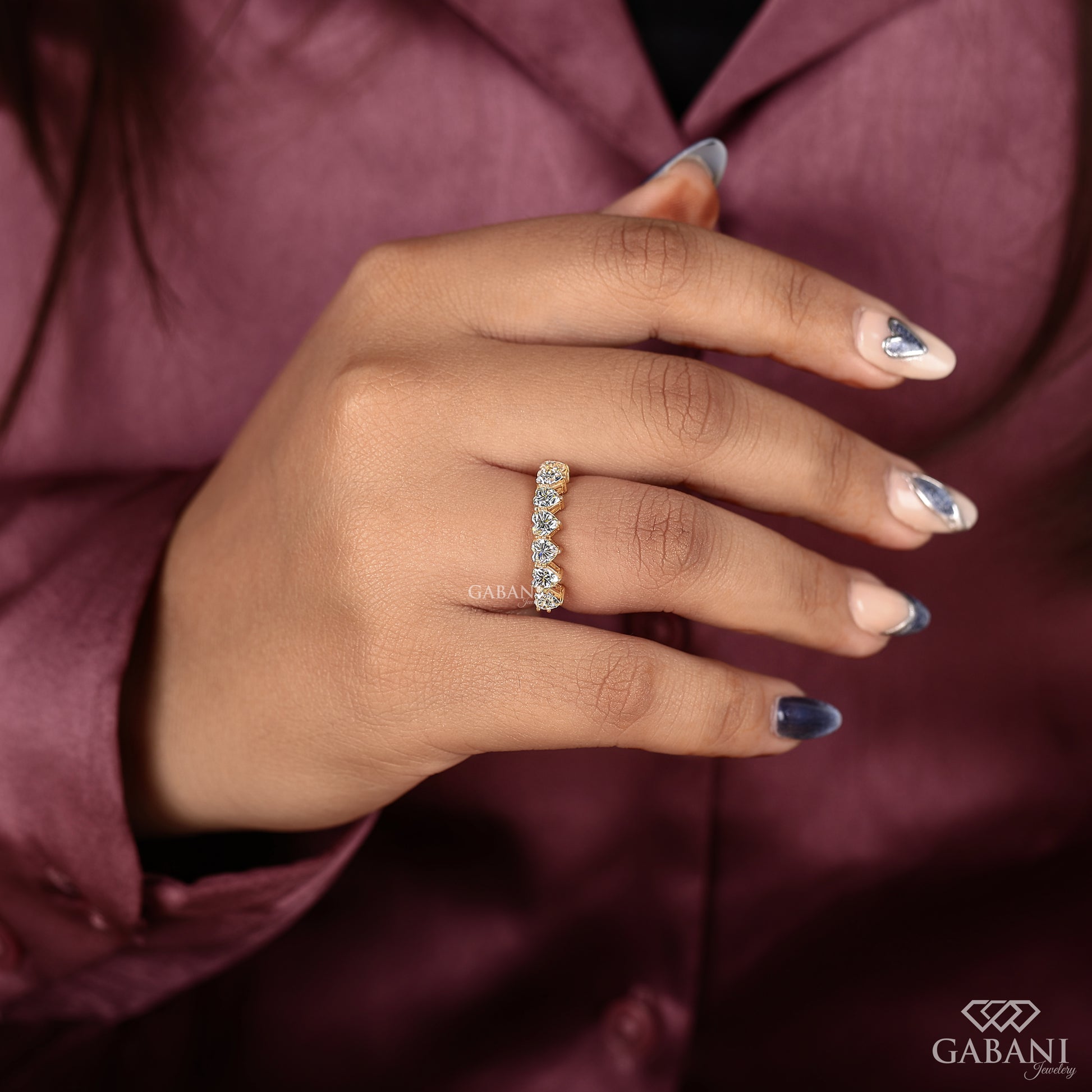 seven heart diamond stacking band in yellow gold