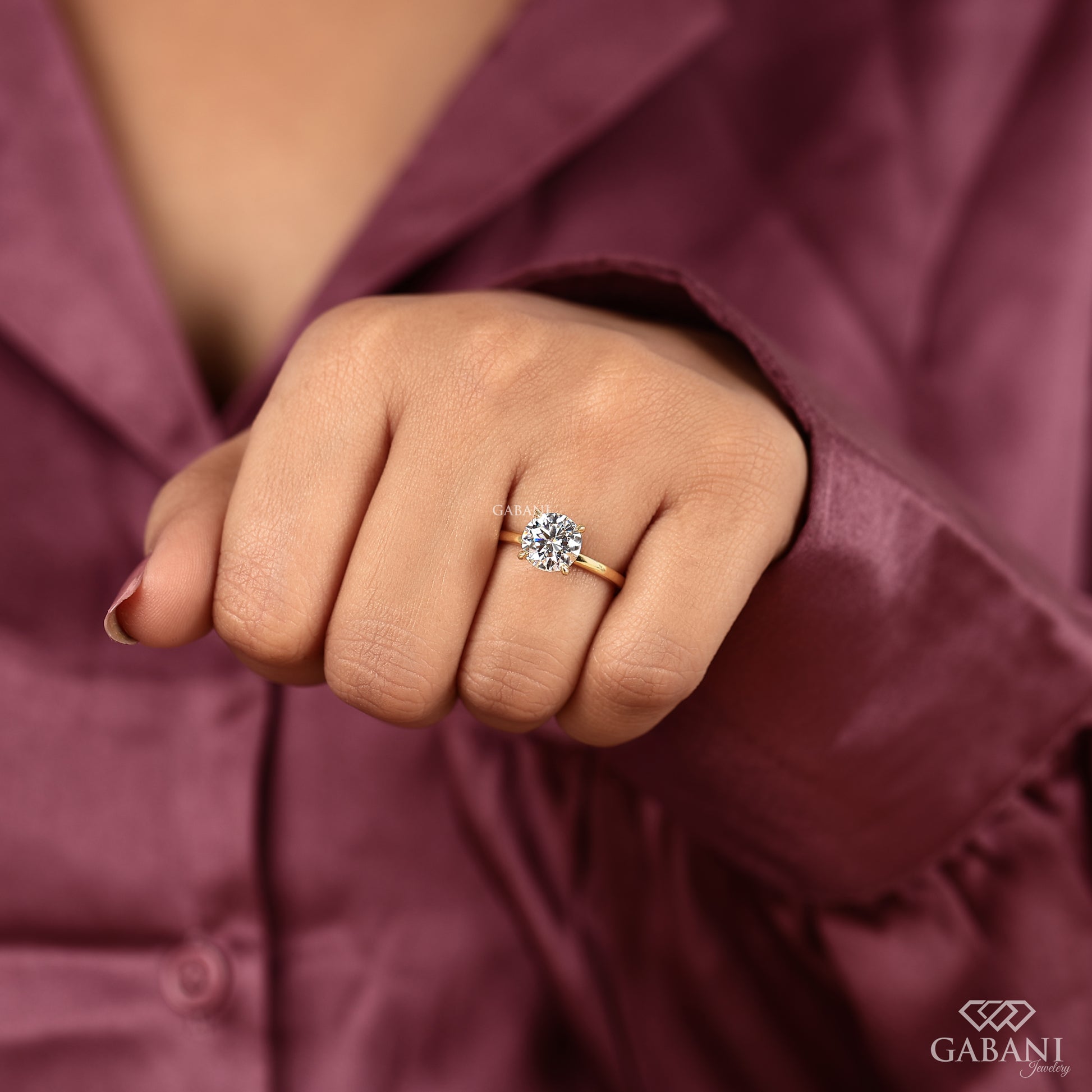 round lab grown diamond engagement ring with simple yellow gold band