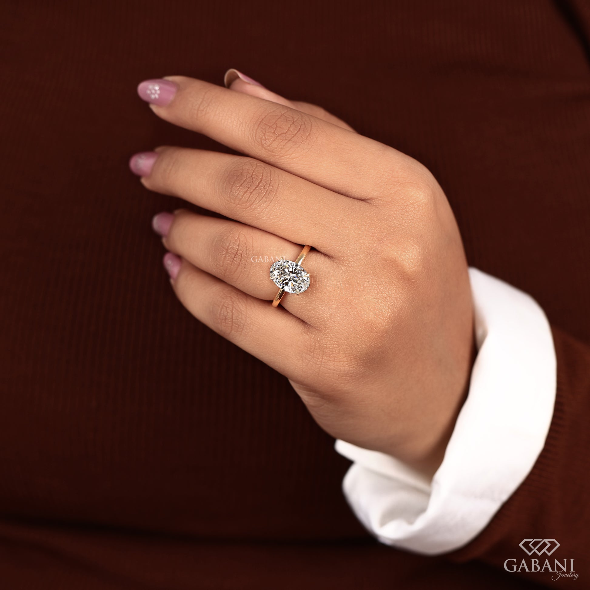 classic oval cut solitaire engagement ring in gold
