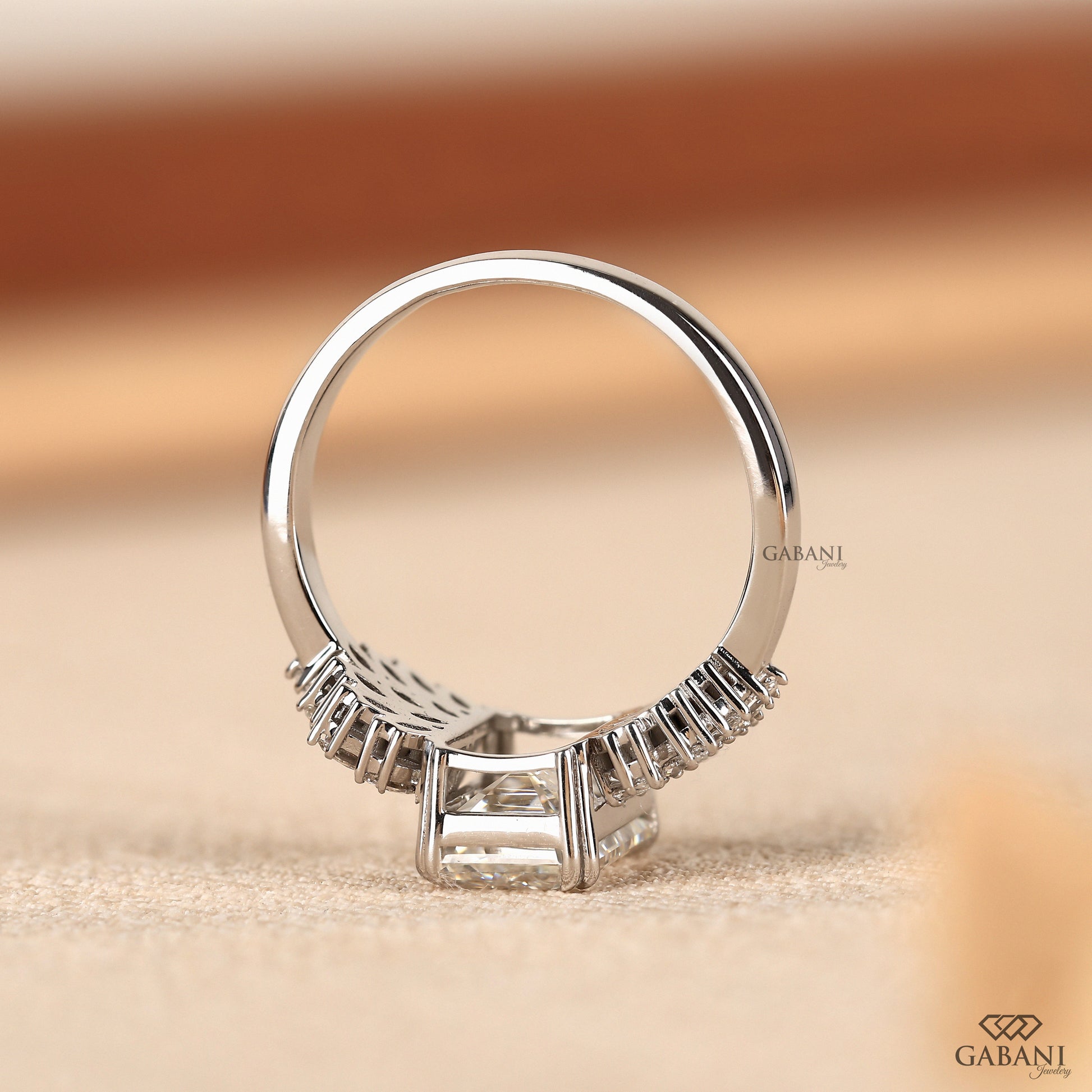 bold emerald cut lab grown diamond engagement ring with pipe style white gold shank