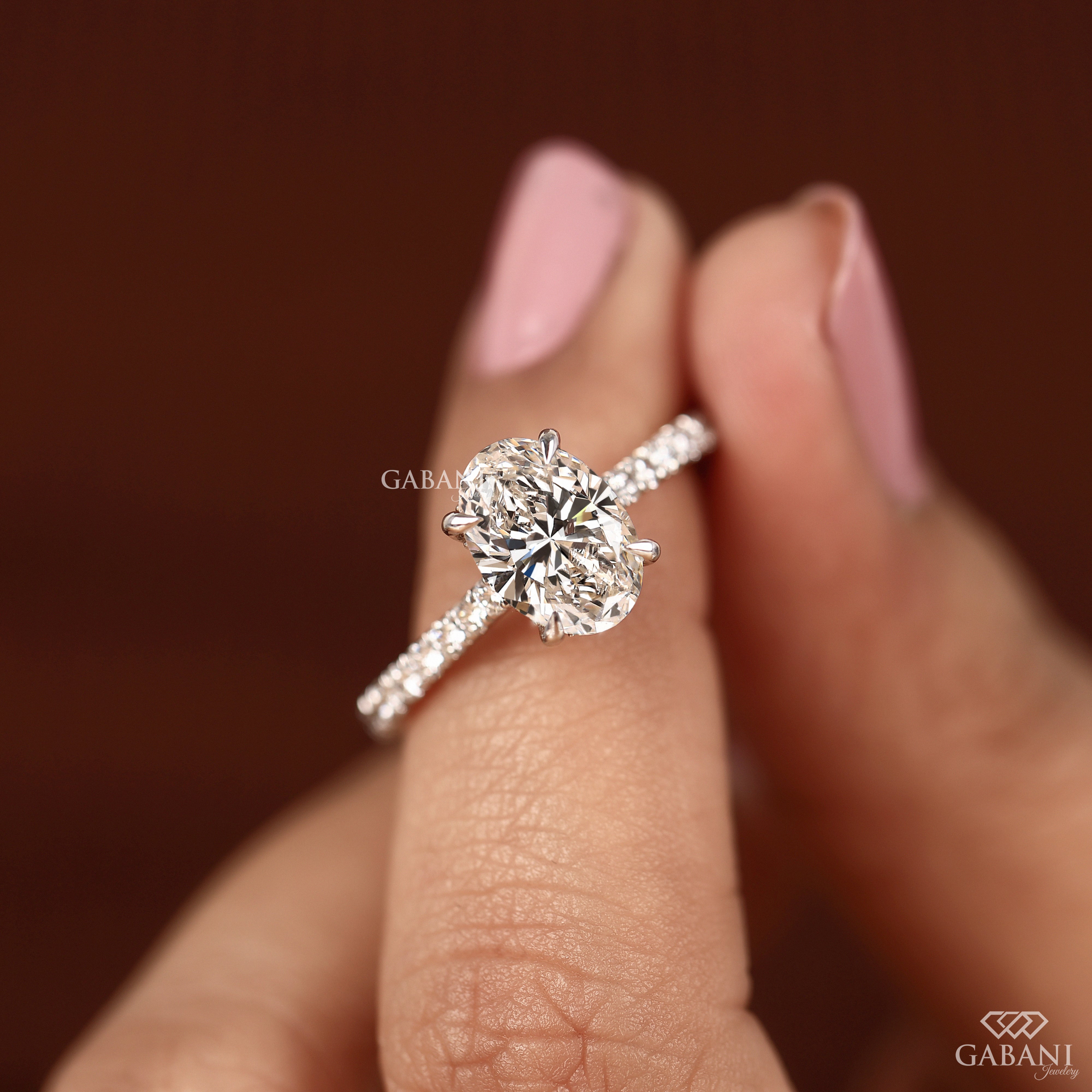 Lab grown oval diamond engagement ring with hidden halo