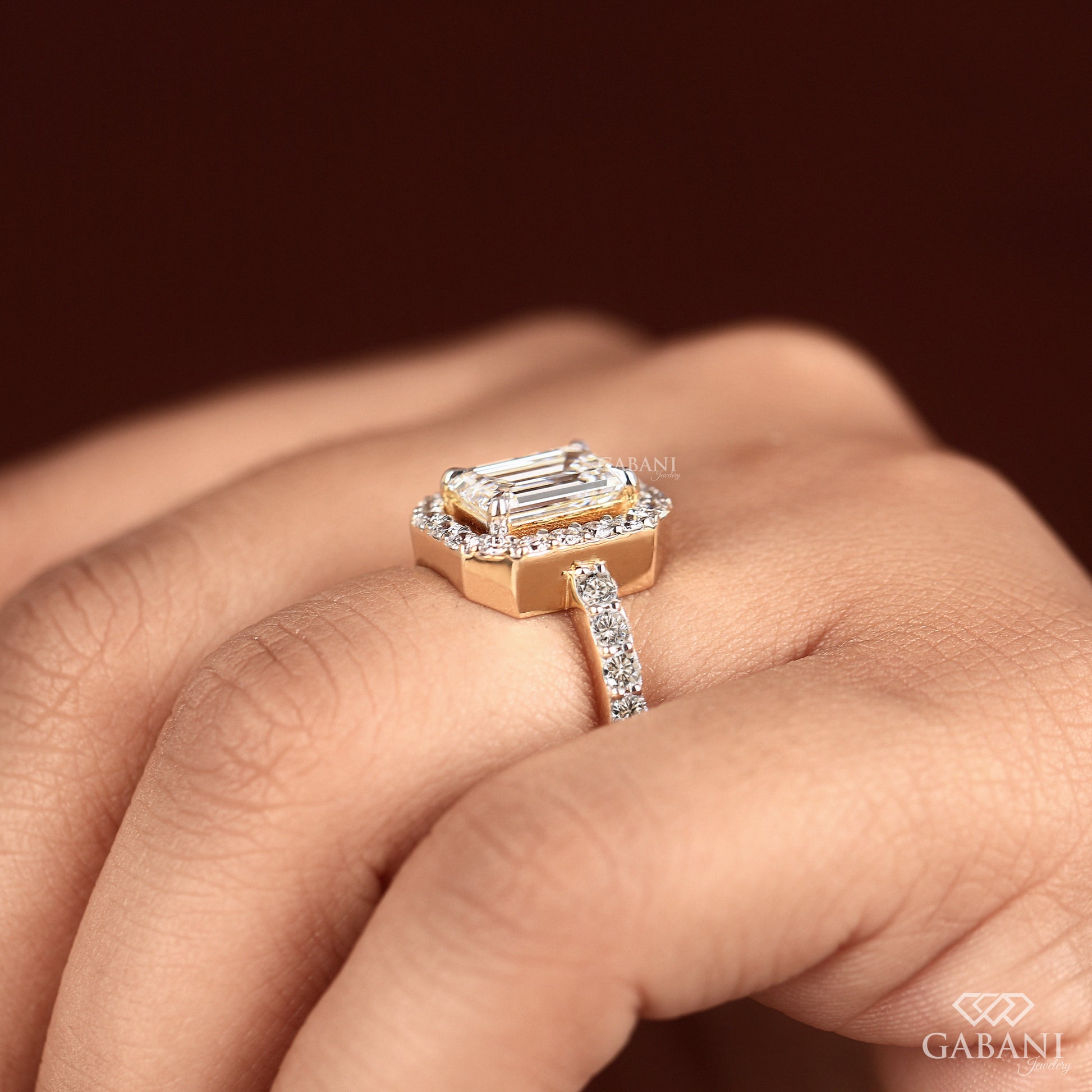 emerald cut lab grown diamond halo engagement ring with clean geometric design