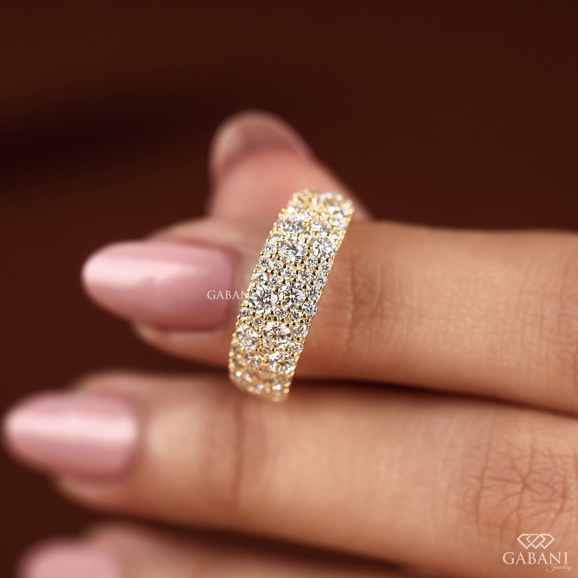wide comfort fit gold band with round lab diamonds in scattered layout