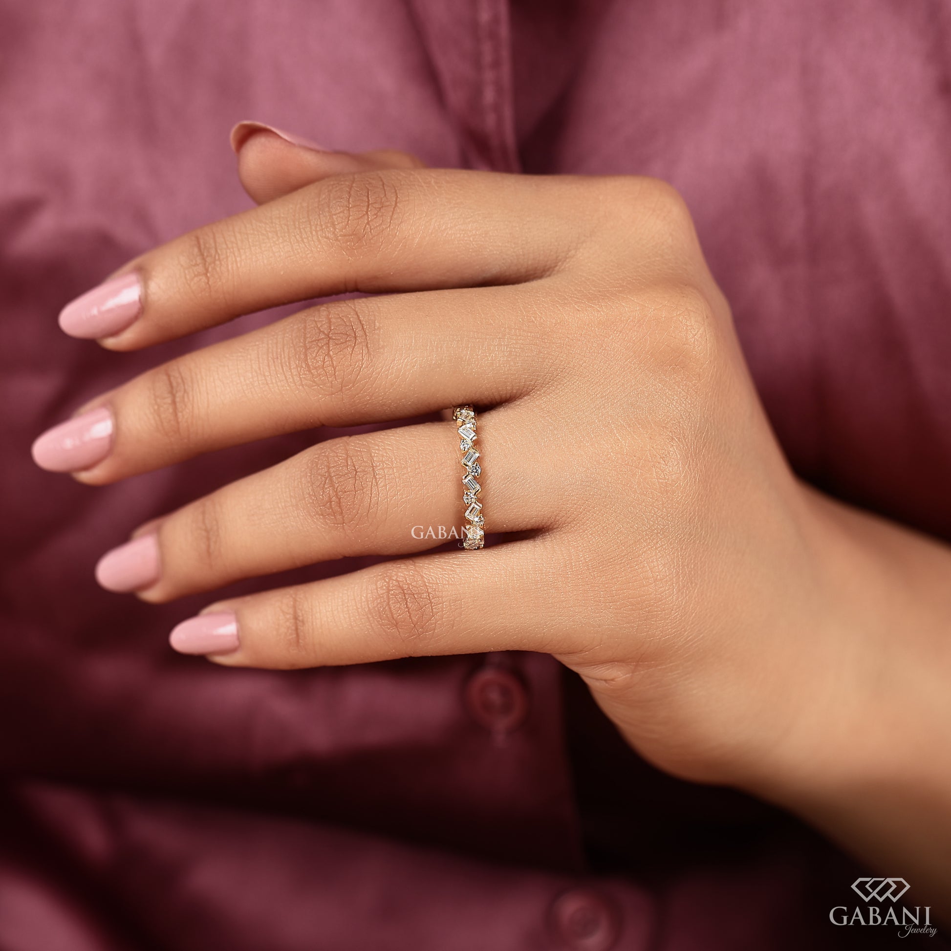 Yellow gold stacking band with modern eternity diamond design