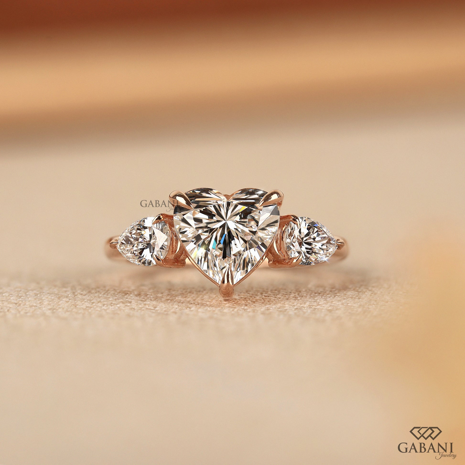 heart cut lab grown diamond three stone engagement ring in 14k gold