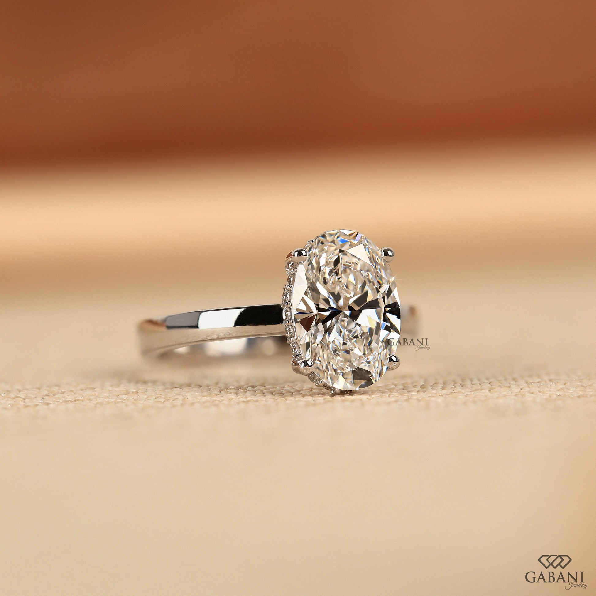 white gold solitaire ring featuring oval cut lab created diamond