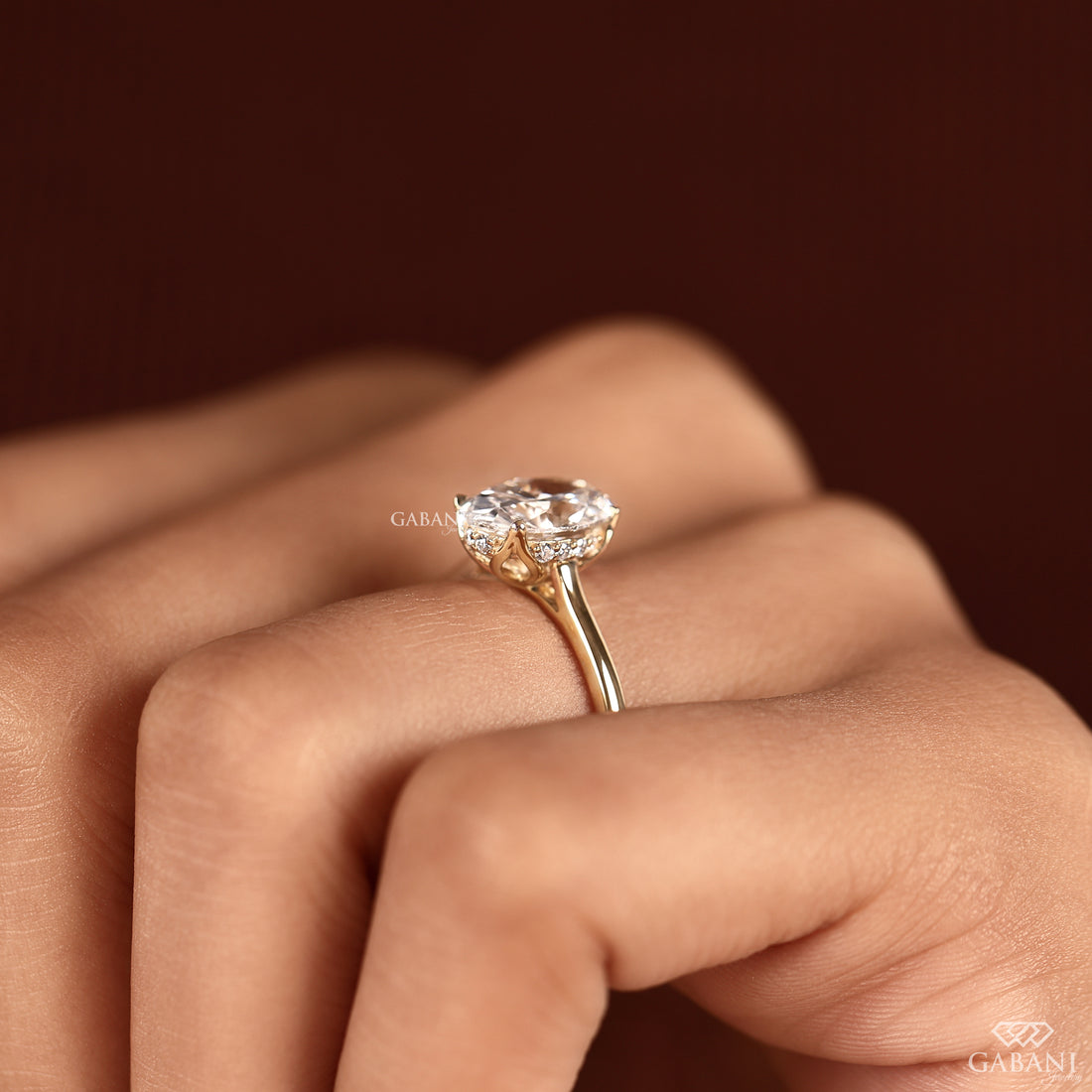 Close-up detail of the oval cut lab grown diamond ring displaying the hidden halo, tulip setting, and handcrafted finish created for a timeless engagement ring.