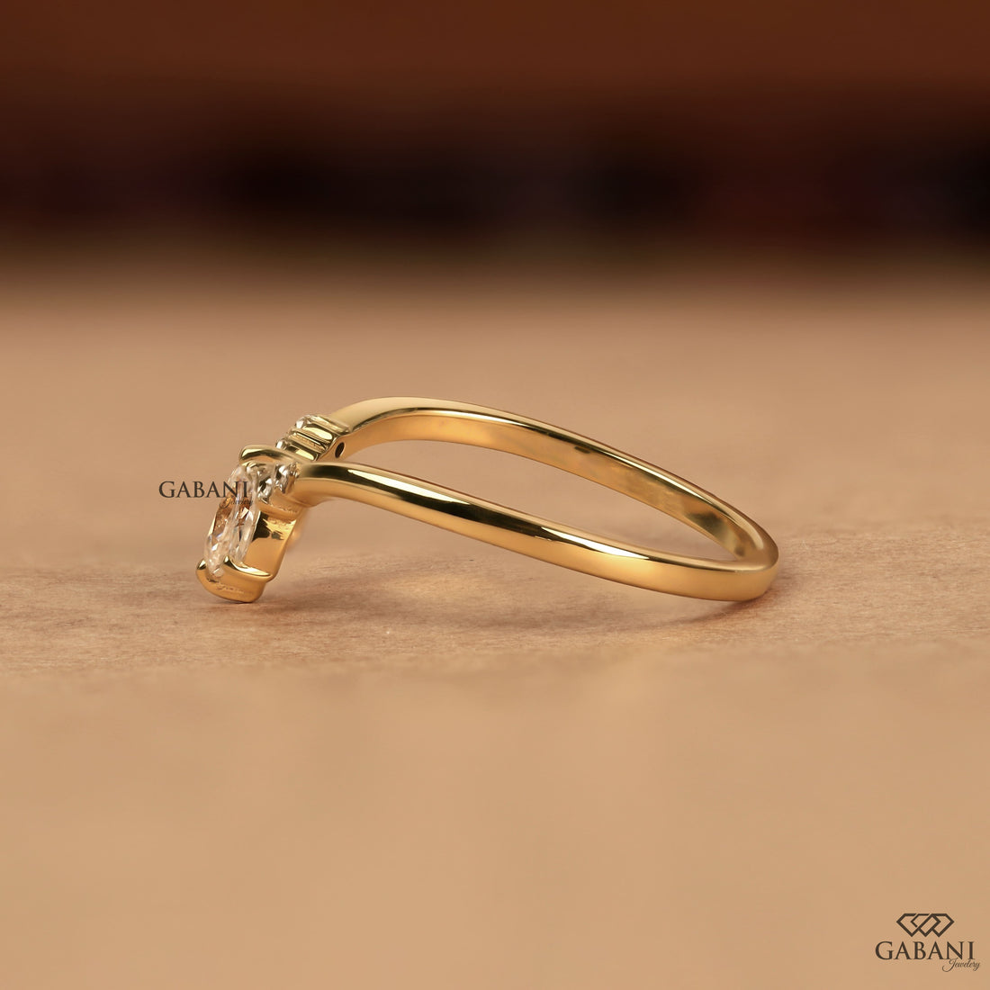 Marquise and round cut lab grown diamond curved wedding band in 14K yellow gold with a contour design, ideal for stacking with an engagement ring.