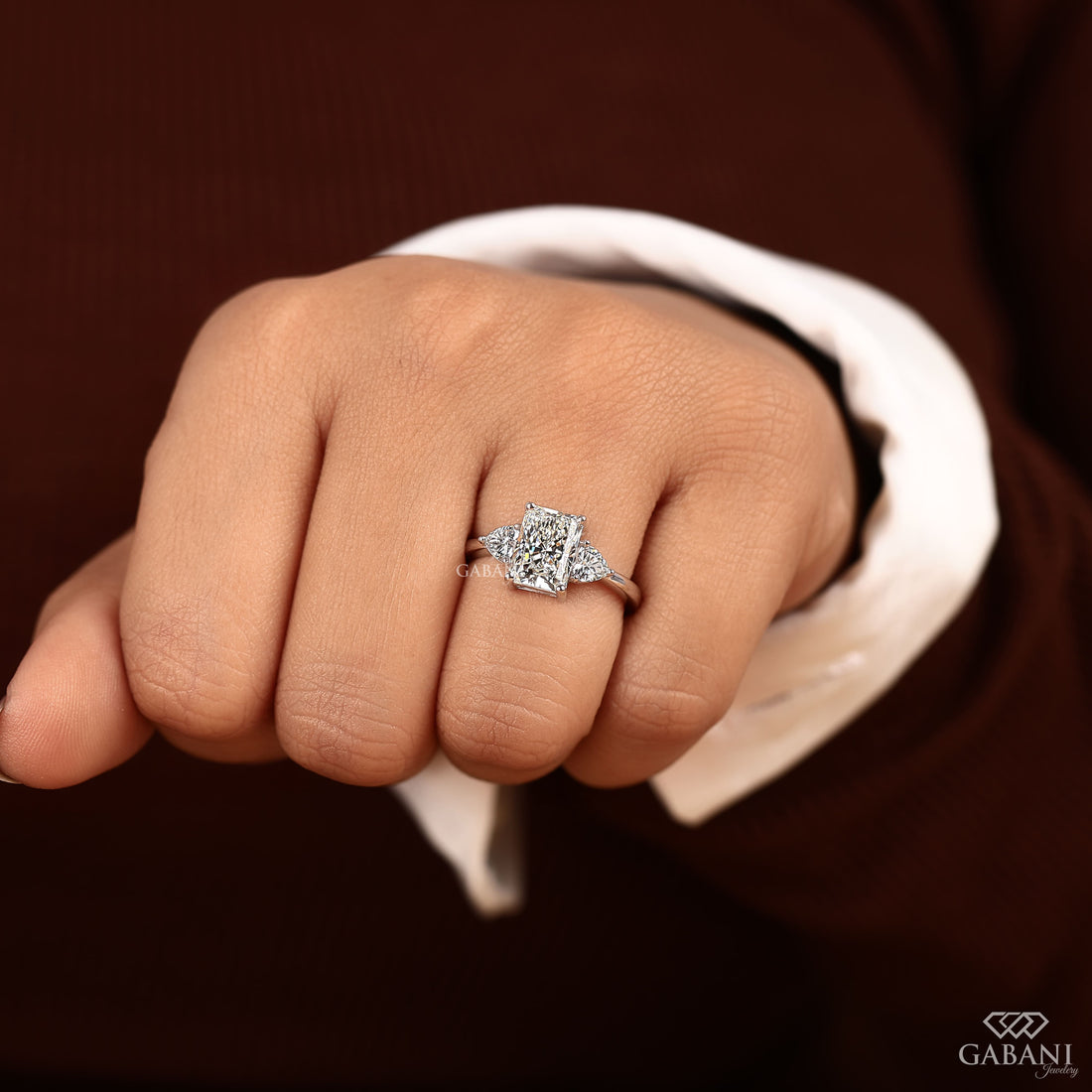 Radiant cut lab grown diamond engagement ring with heart shaped side stones