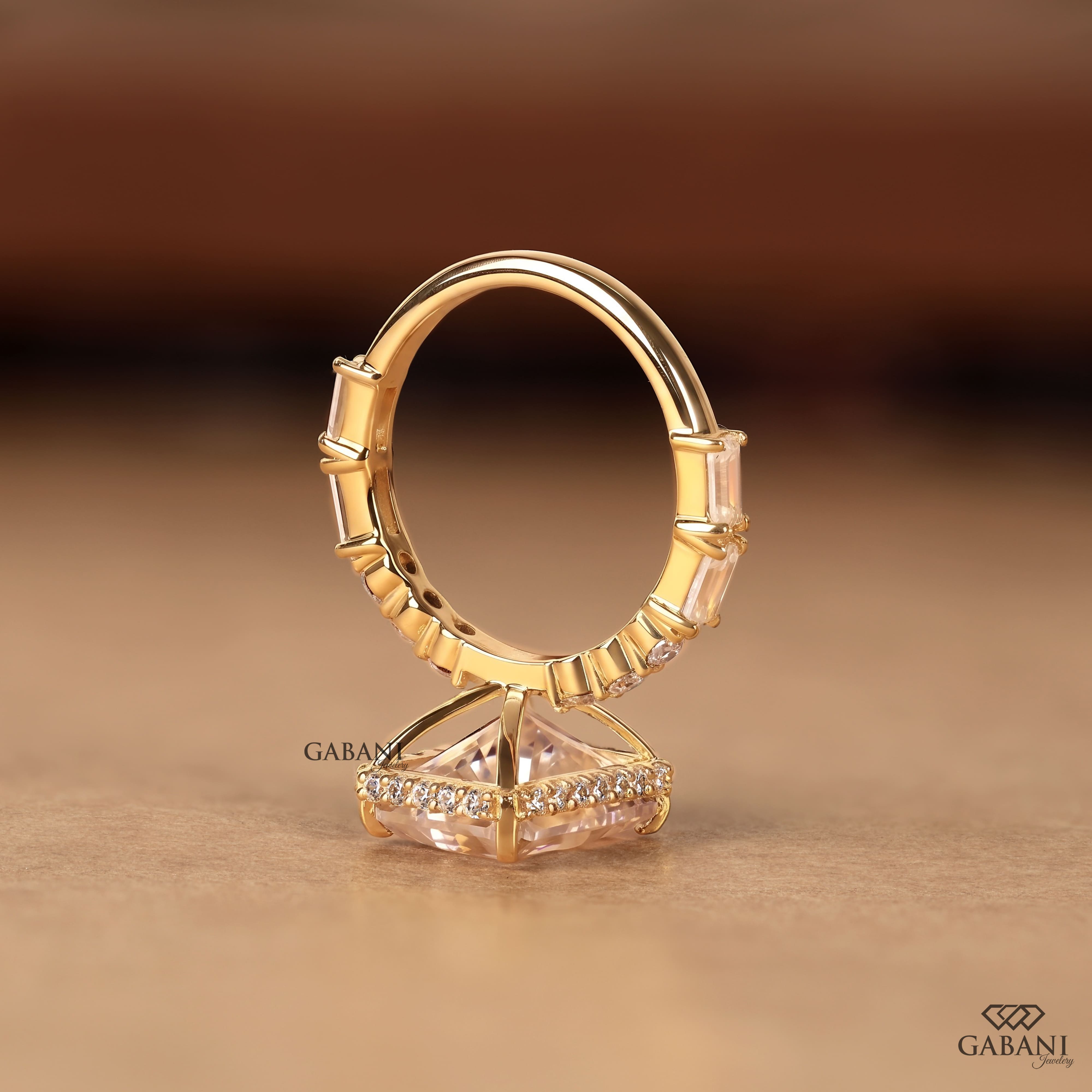Radiant cut lab grown diamond engagement ring with hidden halo, round and baguette side diamonds, and polished gold band.