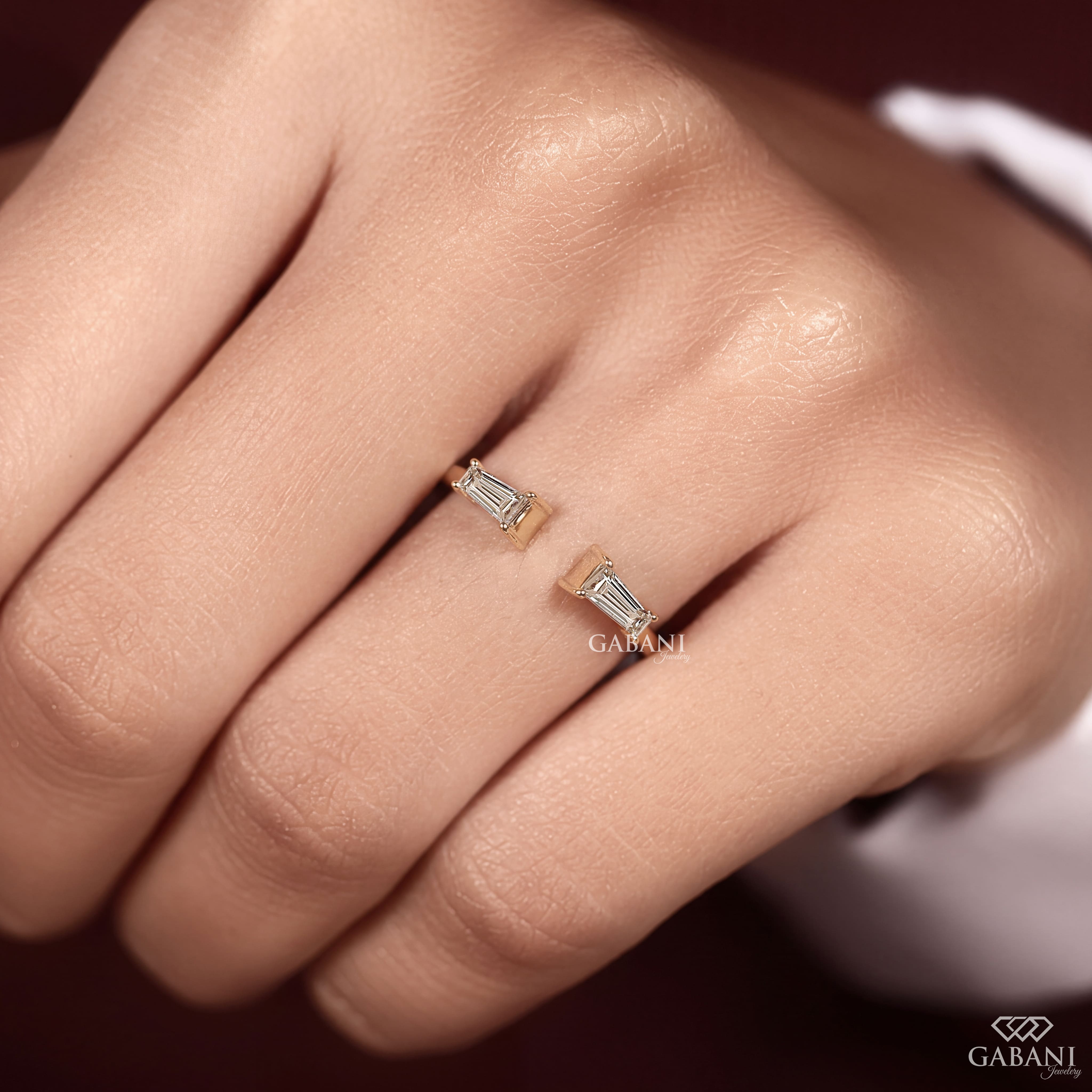 a tapered baguette cut lab grown diamond open cuff ring in 14K yellow gold, featuring two horizontally set diamonds in a modern minimalist design by Gabani Jewelry.