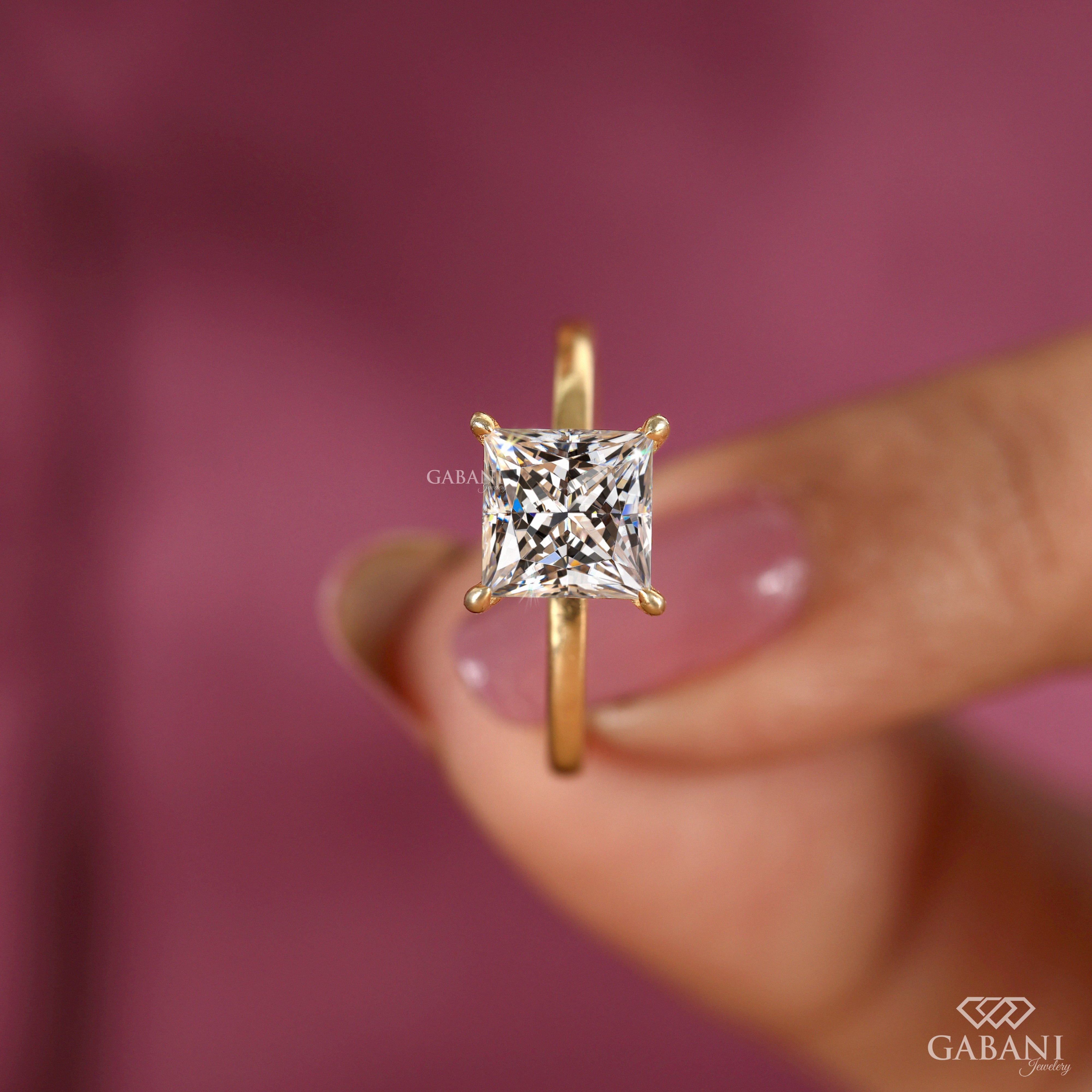 princess cut lab grown diamond solitaire engagement ring in 18K yellow gold with a classic four prong setting and polished band.