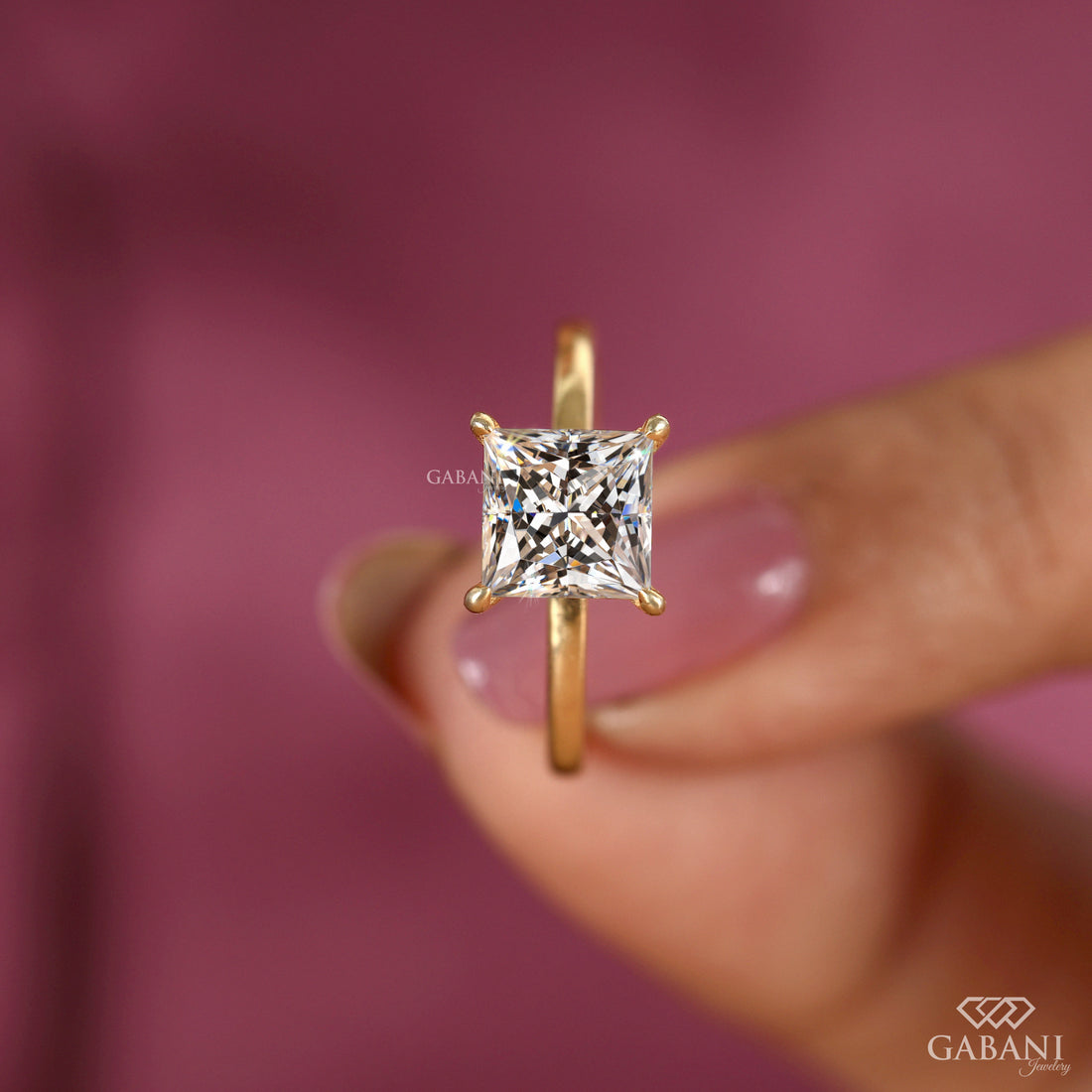 princess cut lab grown diamond solitaire engagement ring in 18K yellow gold with a classic four prong setting and polished band.