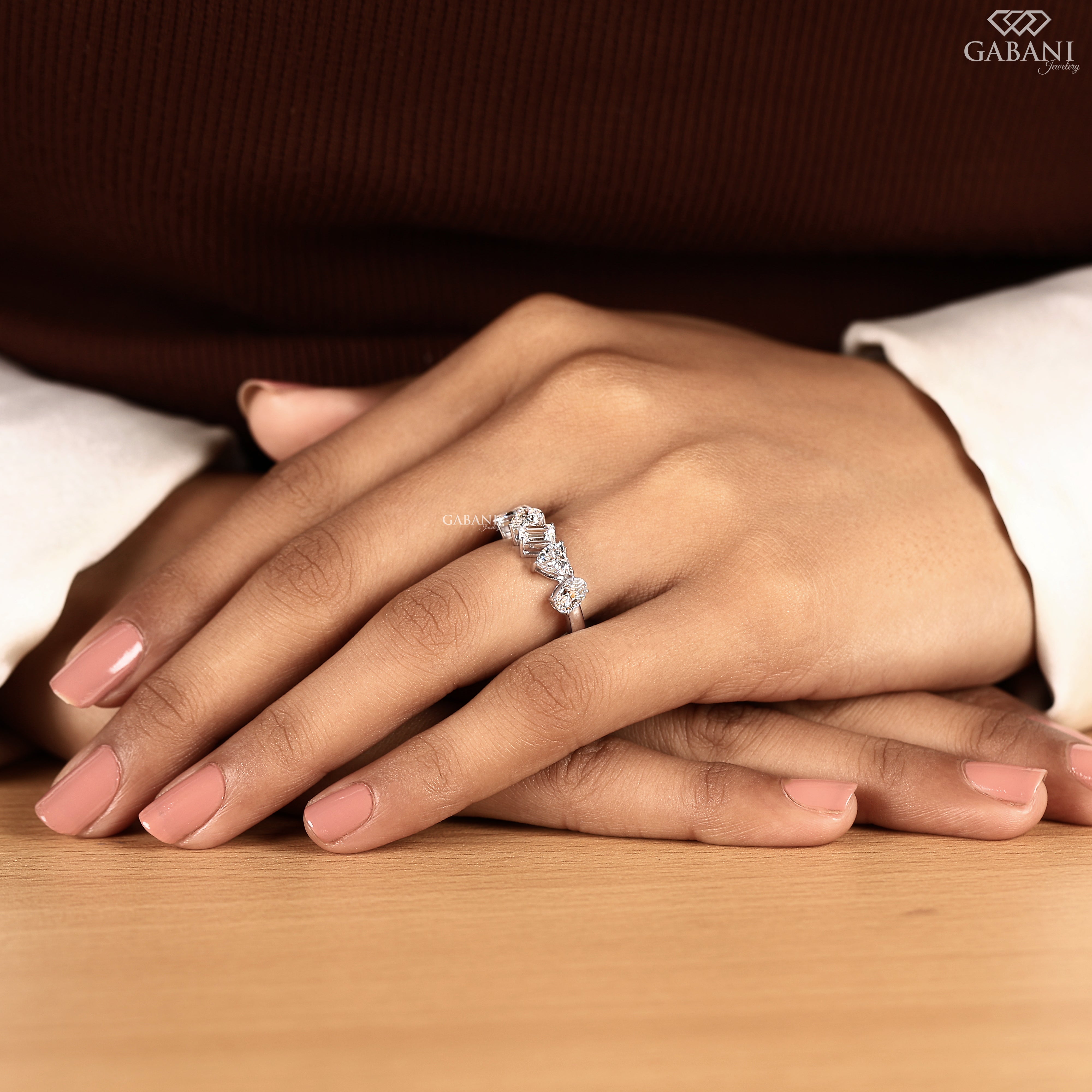 Model wearing multi shape lab grown diamond wedding band in white gold