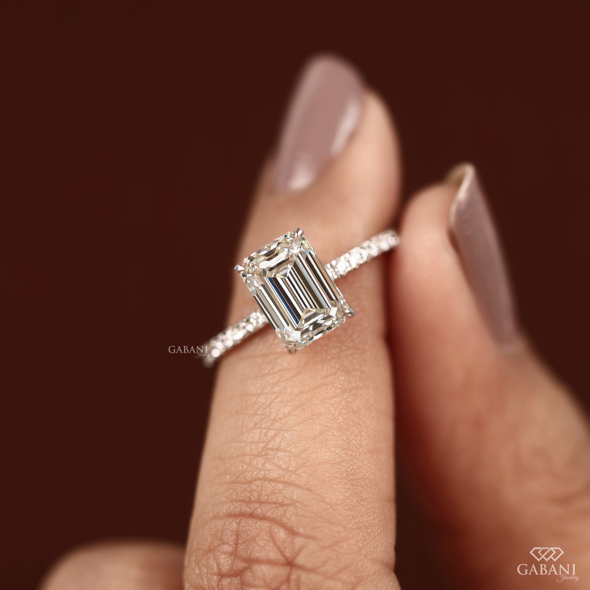 emerald cut lab grown diamond engagement ring with classic prong setting and slim band