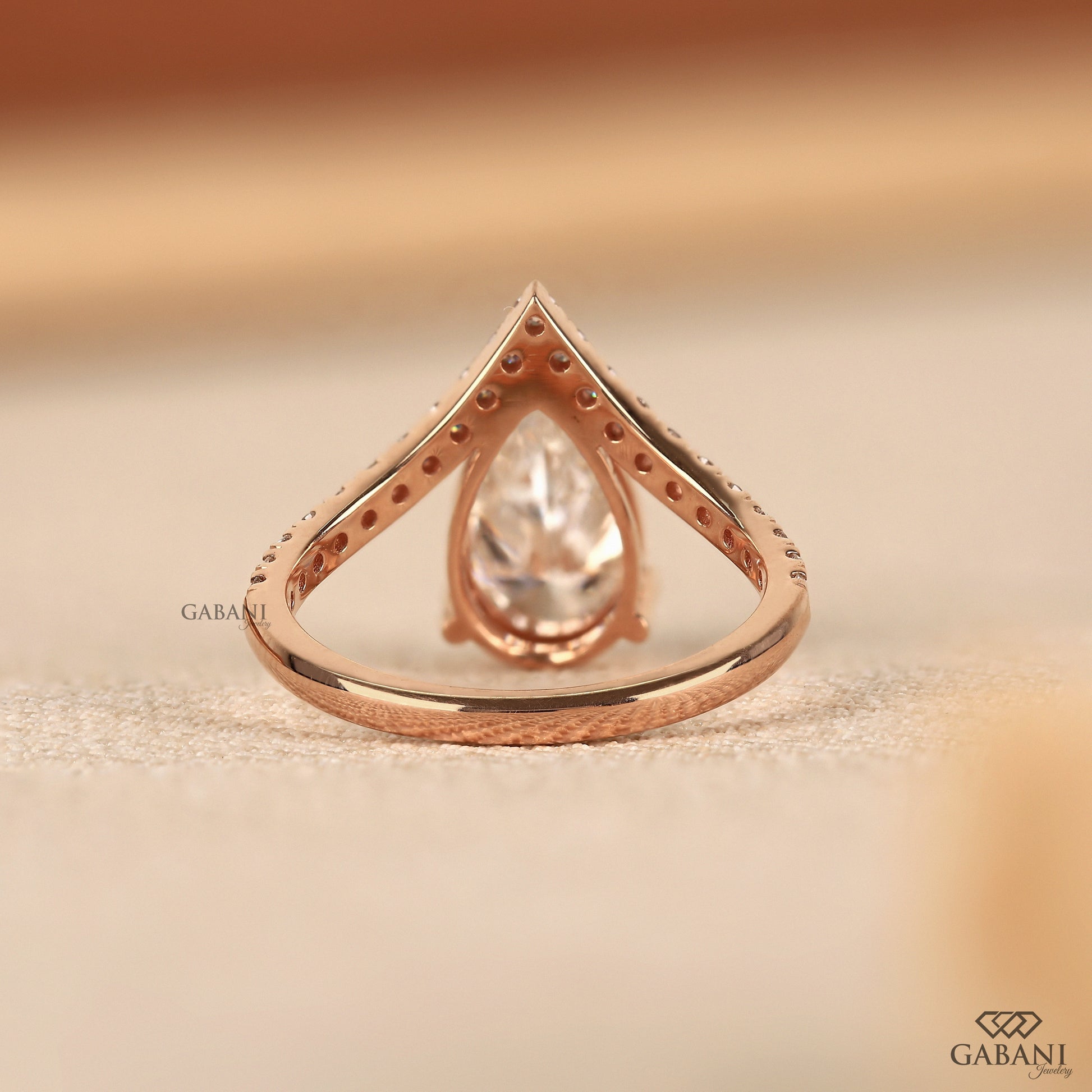 IGI certified lab grown diamond pear ring with pavé set band