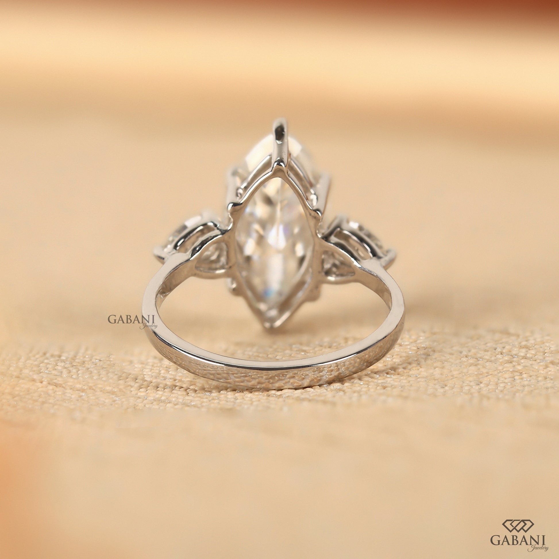 IGI certified lab grown diamond three stone ring with marquise center in solid white gold