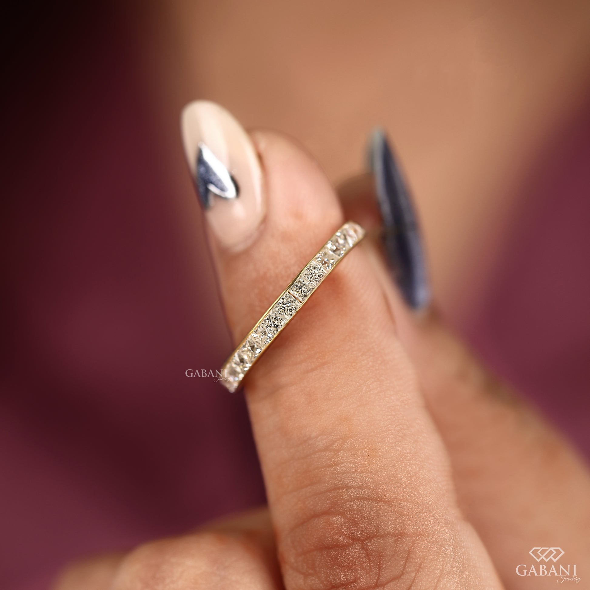 channel set princess cut lab grown diamond band crafted in yellow gold with smooth low profile