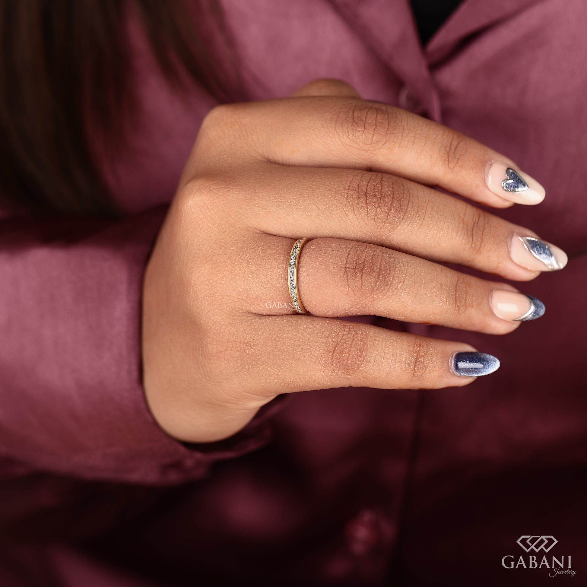 delicate yellow gold band with tiny channel set lab grown diamonds